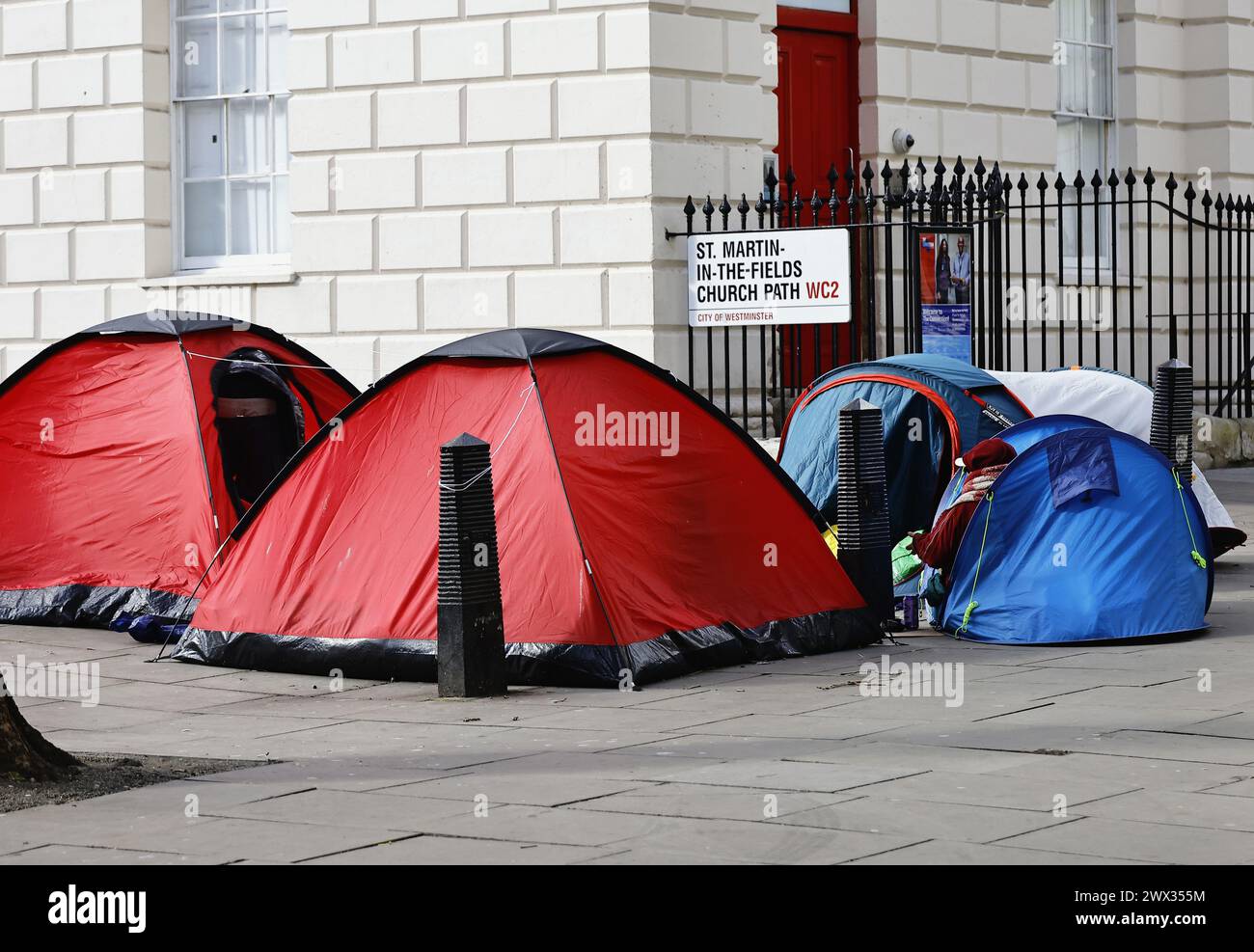 England, London, Westminster, St Martins in the Field, Homeless people camping on the pavement. Stock Photo