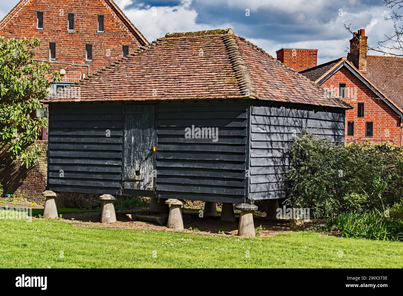 Typical granary storage mounted on Staddlestones. Hall Place, Bexley. Stock Photo
