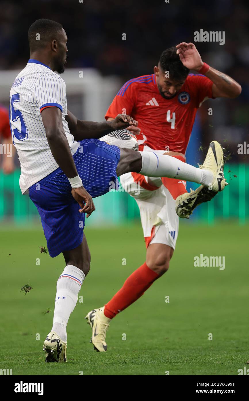 Marseille, 26th March 2024. Marcus Thuram of France is challenged by Mauricio Isla of Chile during the International Friendly match at Orange Vélodrome, Marseille. Picture credit should read: Jonathan Moscrop/Sportimage Credit: Sportimage Ltd/Alamy Live News Stock Photo