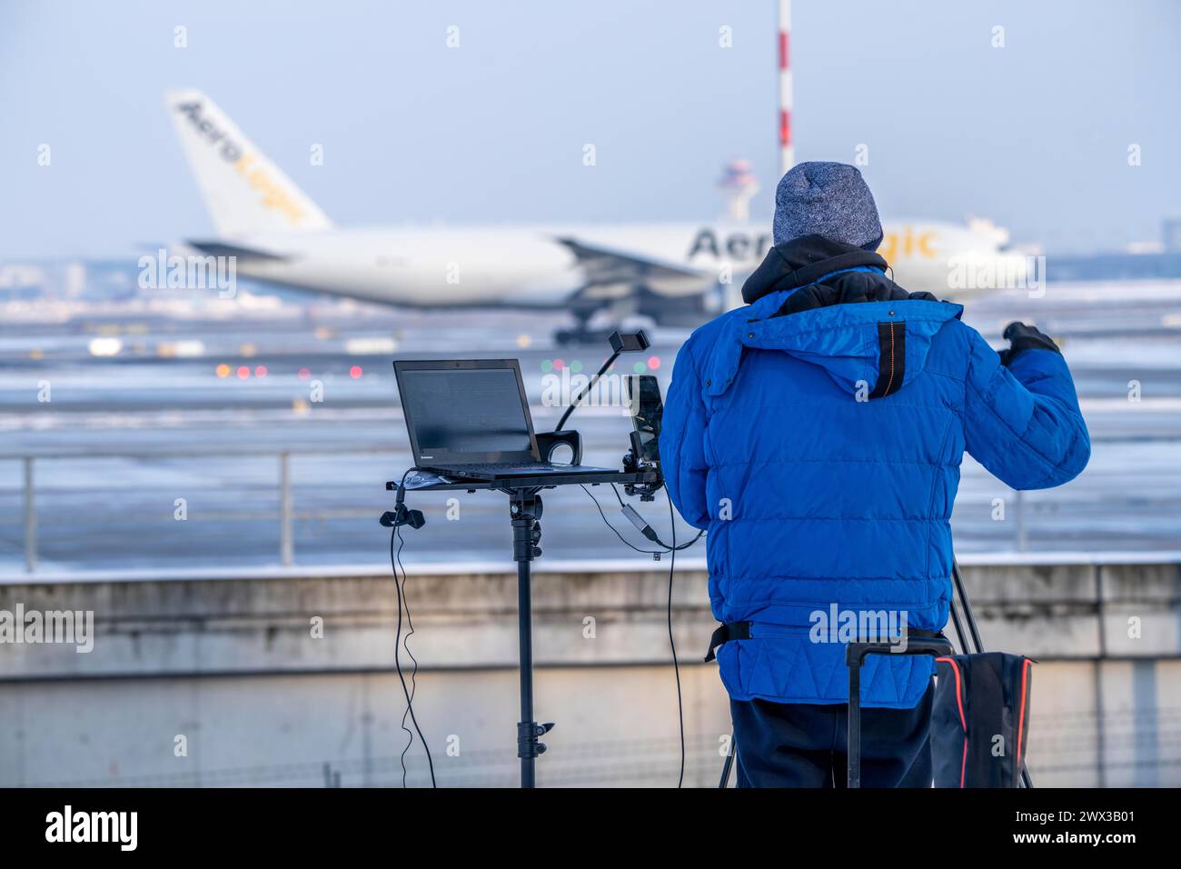 Planespotting, live, at Frankfurt Airport, a spotter broadcasts the traffic at Runway West live on the Internet via video stream, Stock Photo