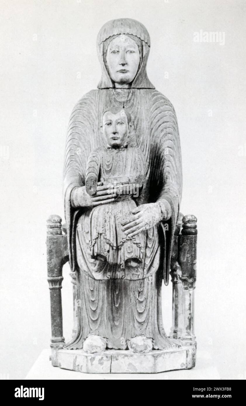 A painted wooden statue of the Virgin and Child, crafted from oak ...