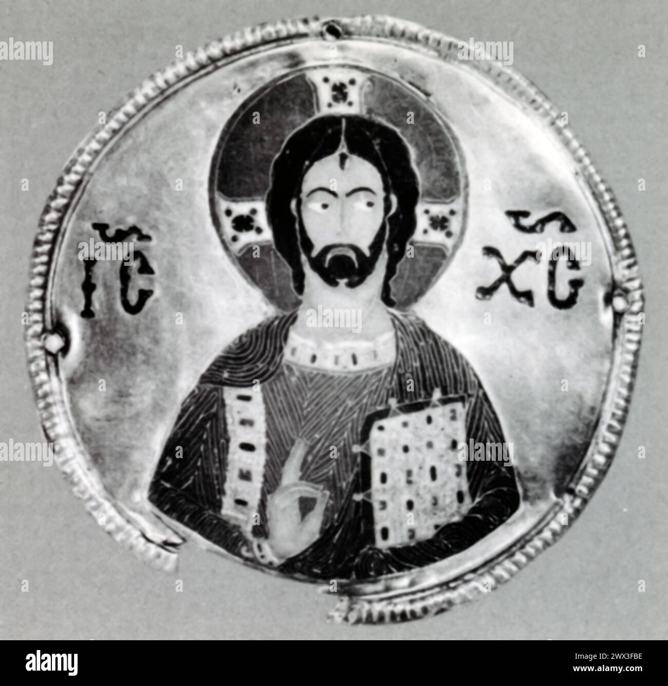 A detail of Christ, a piece of cloisonné enamel on gold from the Byzantine period, specifically the 11th century, originating from Djumati, Georgia. Cloisonné, a technique used for decorative purposes in metalwork, involves creating compartments (cloisons) with metal wires or strips placed on a metal object and filling these compartments with enamel paste. The object is then fired, allowing the enamel to melt and fill the cloisons, and polished to reveal a vibrant, intricate design upon cooling. Stock Photo