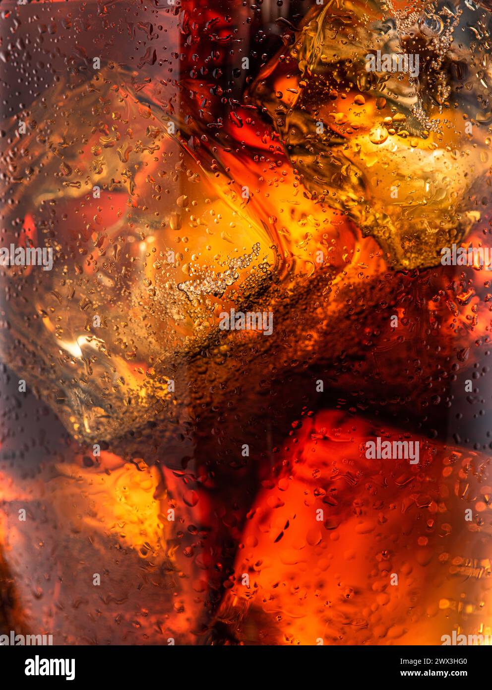 Ice cubes in the cola drink closeup Stock Photo - Alamy