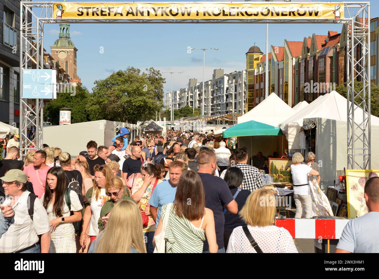 Antiques market bazaar marketplace busy with crowds of people in Dlugi Ogrodi Street during the annual St. Dominic's Fair Gdansk Poland, Europe, EU Stock Photo