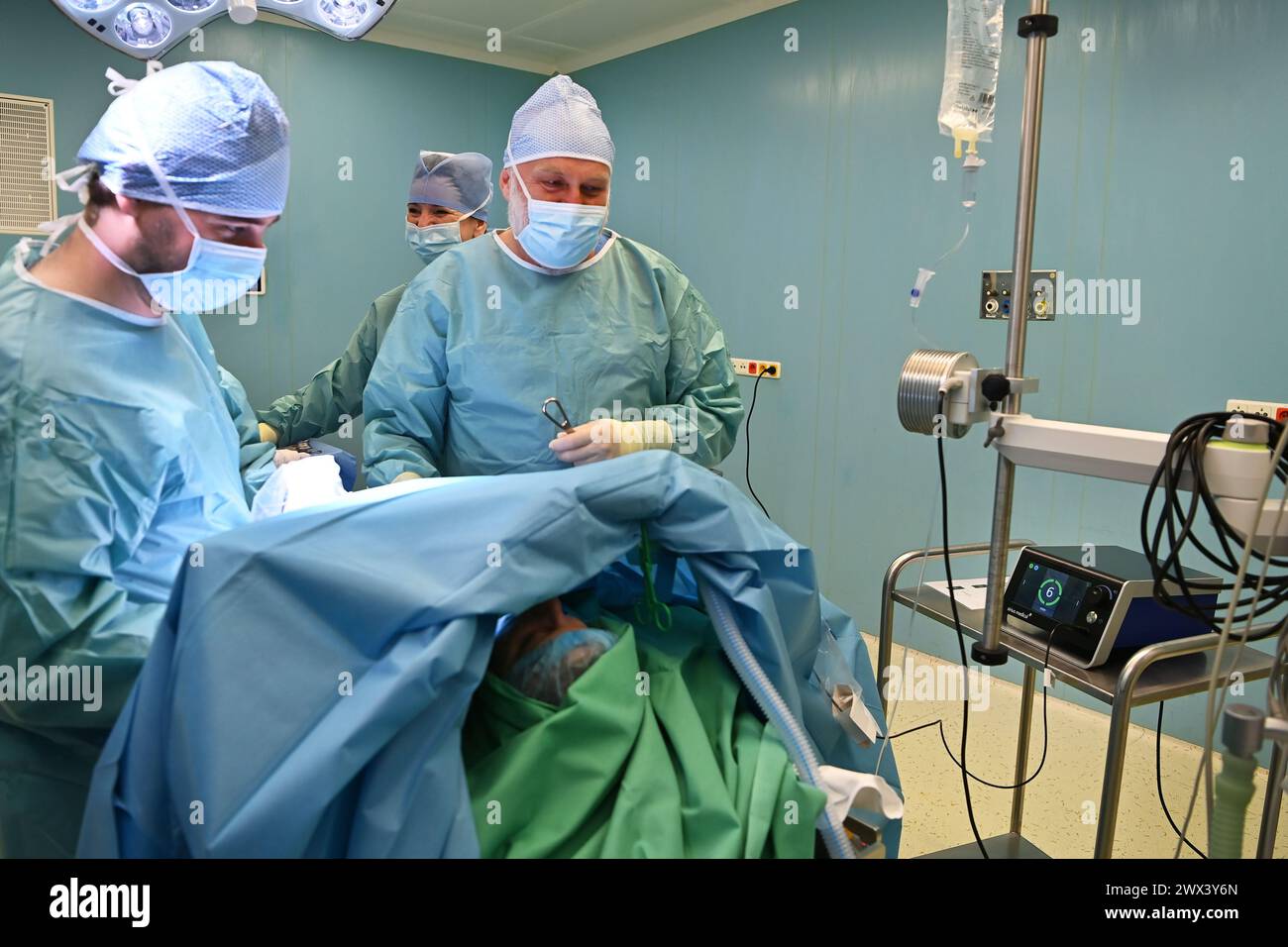 Opava, Czech Republic. 27th Mar, 2024. Surgeons Jan Zatecky, left, and Dobroslav Sekret during breast cancer surgery with the help of new technology from the Dutch company Sirius Medical in Silesian Hospital Opava, Czech Republic, March 27, 2024. During the procedure, a magnetic grain is used to locate smaller tumours, thanks to which the tumour can be found and removed with a precision of one millimetre. Credit: Jaroslav Ozana/CTK Photo/Alamy Live News Stock Photo
