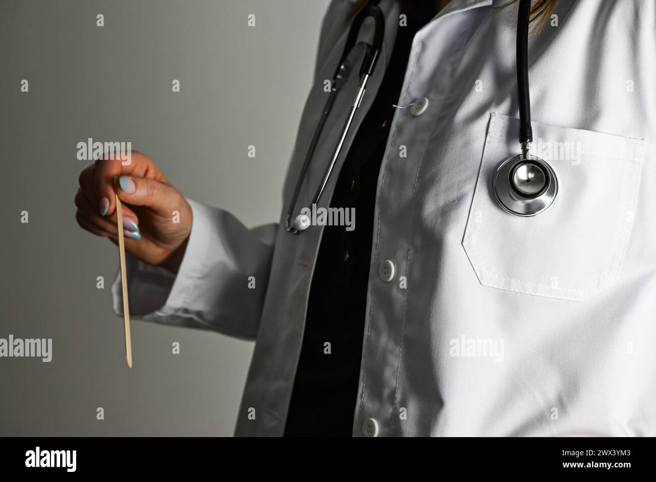 Female doctor in coat holding hi-res stock photography and images - Alamy