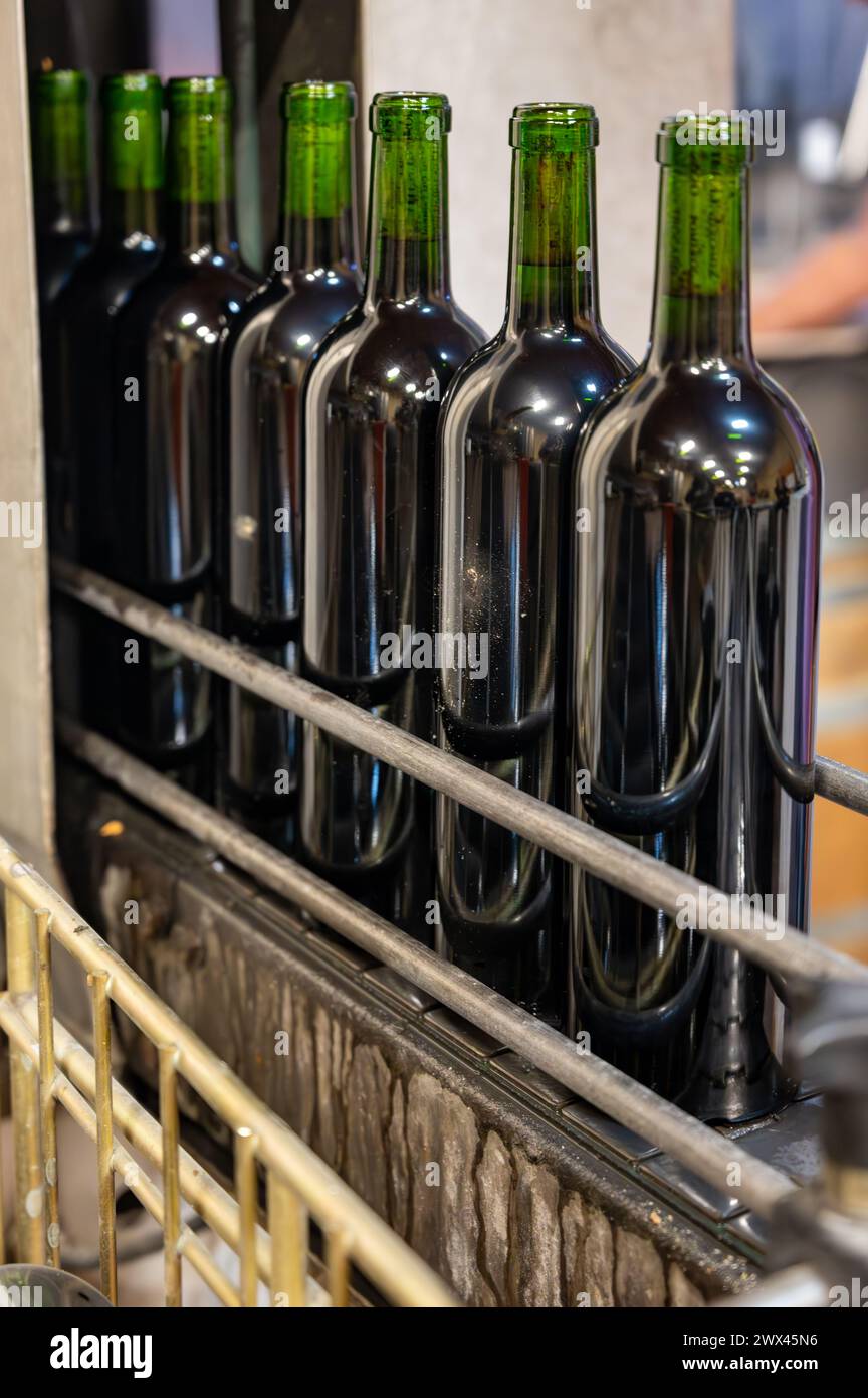 Wine making line, bottling and corking line in underground cellar, Saint-Emilion wine making region picking, cru class Merlot or Cabernet Sauvignon re Stock Photo
