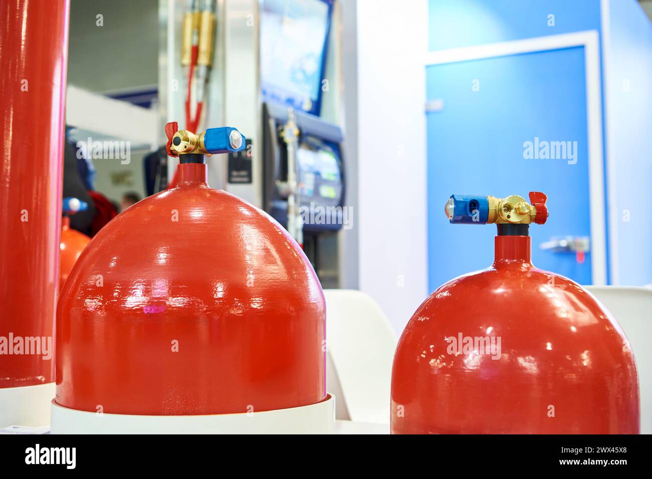 Red metal gas cylinders for filling stations Stock Photo