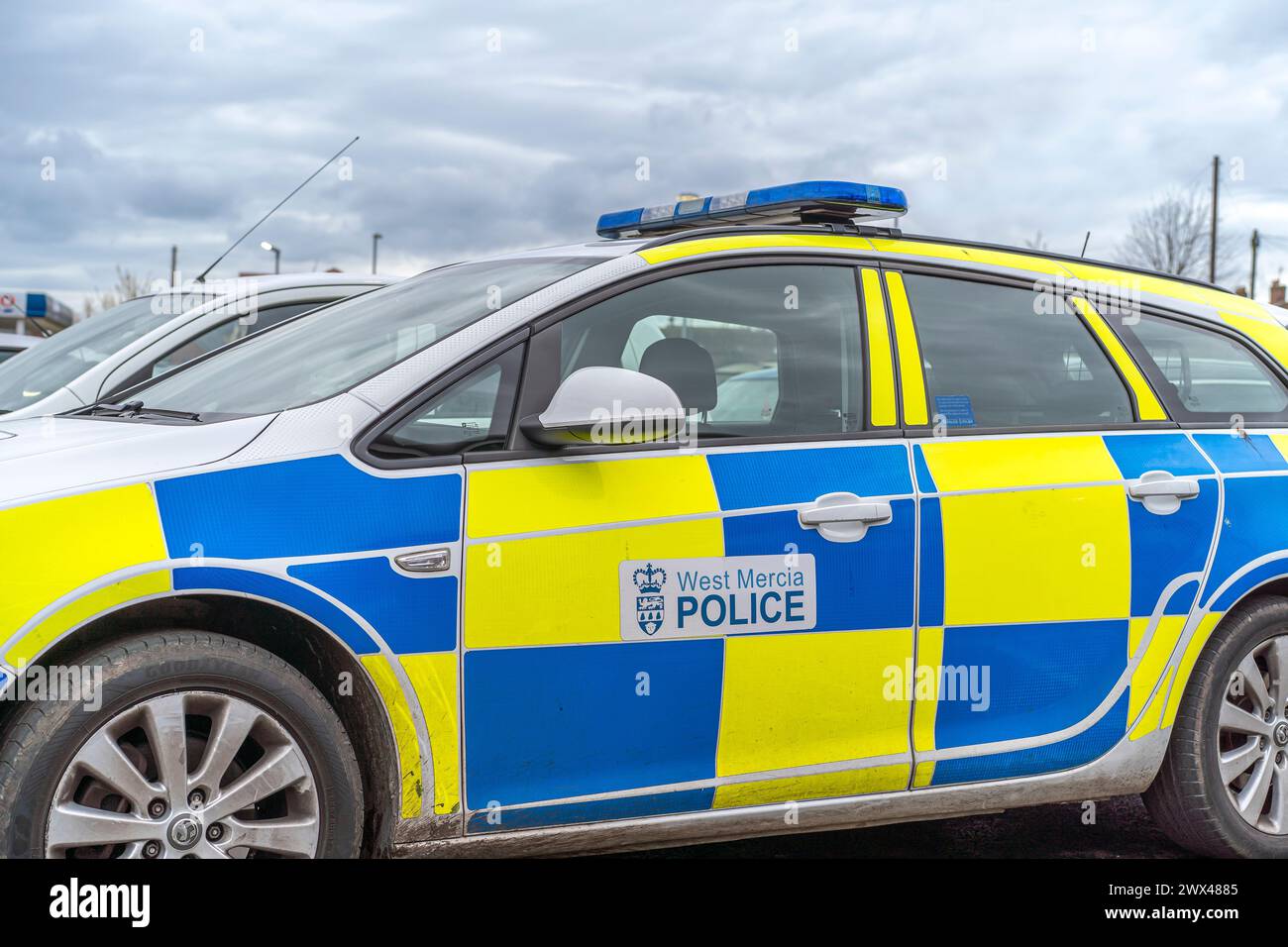 Low angle, side view close up of West Mercia Police car (passenger side, nearside) parked