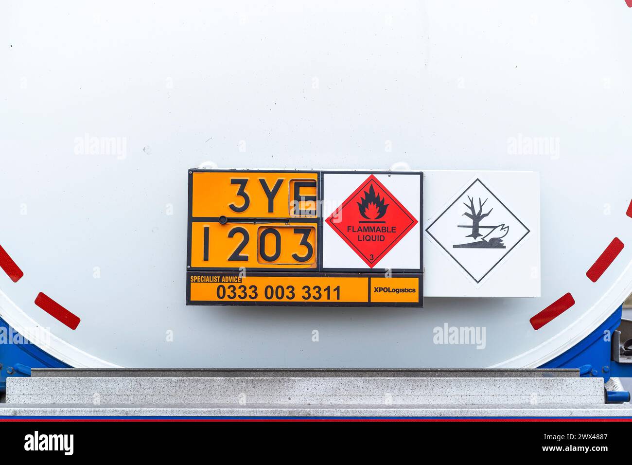 Close up rear view of a petrol tanker with a flammable liquid warning sign. Stock Photo