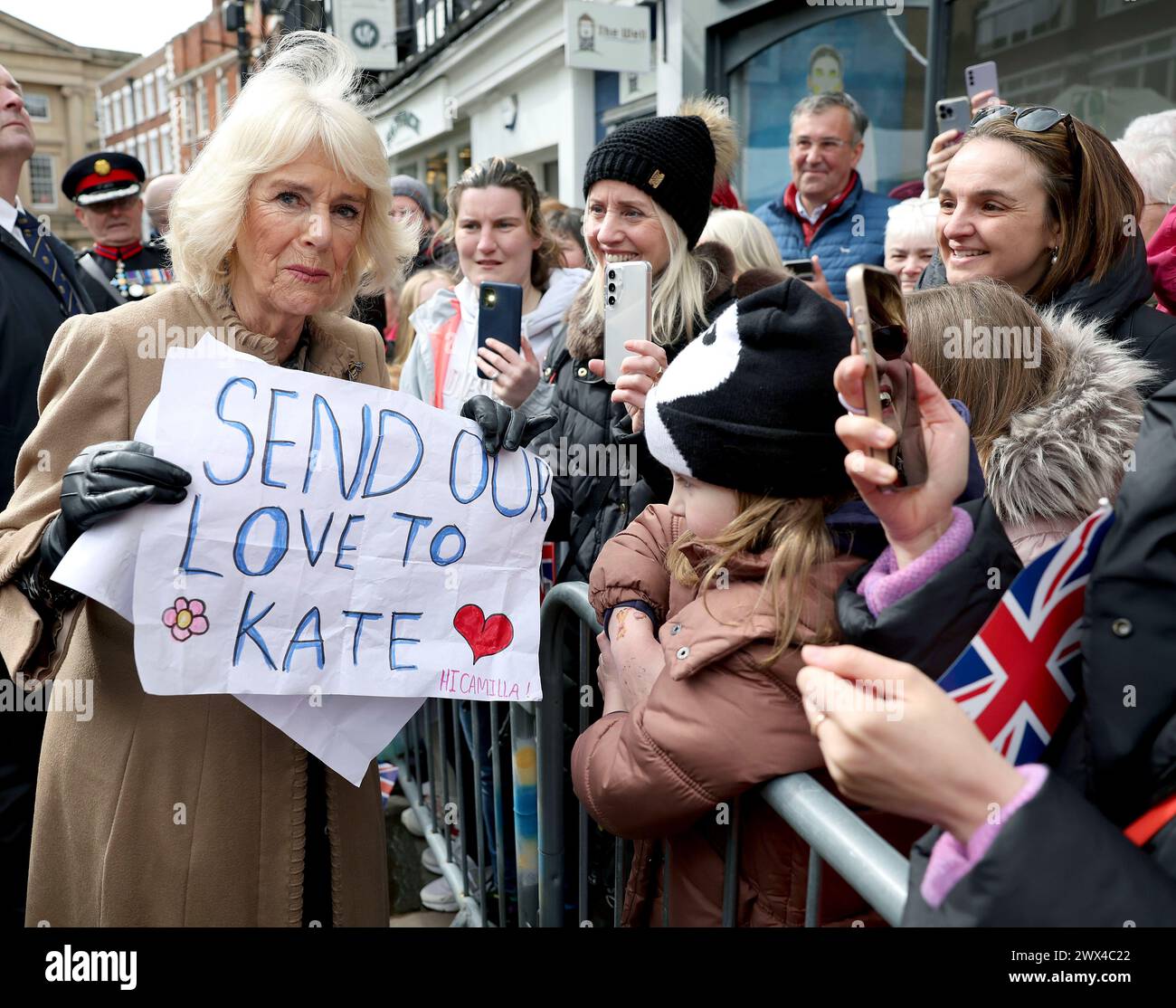 Britain's Queen Camilla receives a message of support for Kate, Princess of Wales from well wishers, during her visit to the Farmers' Market in Shrewsbury, England, Wednesday March 27, 2024. (Chris Jackson/Pool via AP) Stock Photo