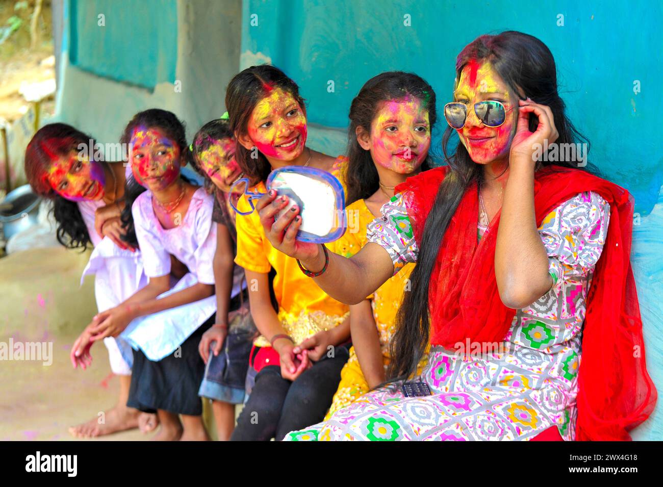 Sylhet, Bangladesh. 27th Mar, 2024. Bangladeshi women painting their faces with colors like Rainbows as part of the celebration of the annual Hindu festival of colors, known as Holi festival marking the onset of spring. on March 27, 2024 in Sylhet, Bangladesh. (Credit Image: © Md Rafayat Haque Khan/eyepix via ZUMA Press Wire) EDITORIAL USAGE ONLY! Not for Commercial USAGE! Stock Photo