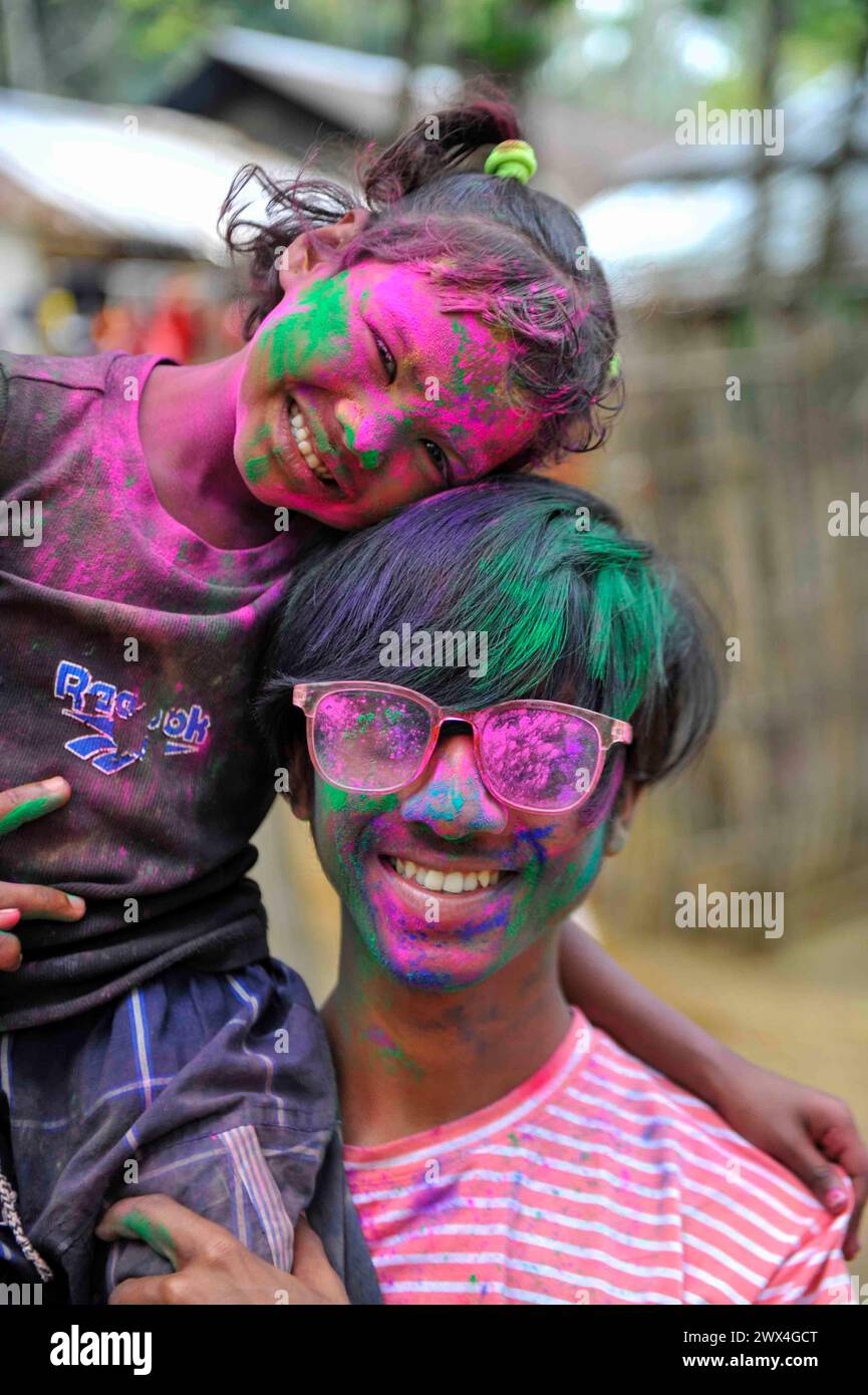 Sylhet, Bangladesh. 27th Mar, 2024. Bangladeshi children pose for photos after adorning with colors their faces like Rainbows as part of the celebration of the annual Hindu festival of colors, known as Holi festival marking the onset of spring. on March 27, 2024 in Sylhet, Bangladesh. (Credit Image: © Md Rafayat Haque Khan/eyepix via ZUMA Press Wire) EDITORIAL USAGE ONLY! Not for Commercial USAGE! Stock Photo