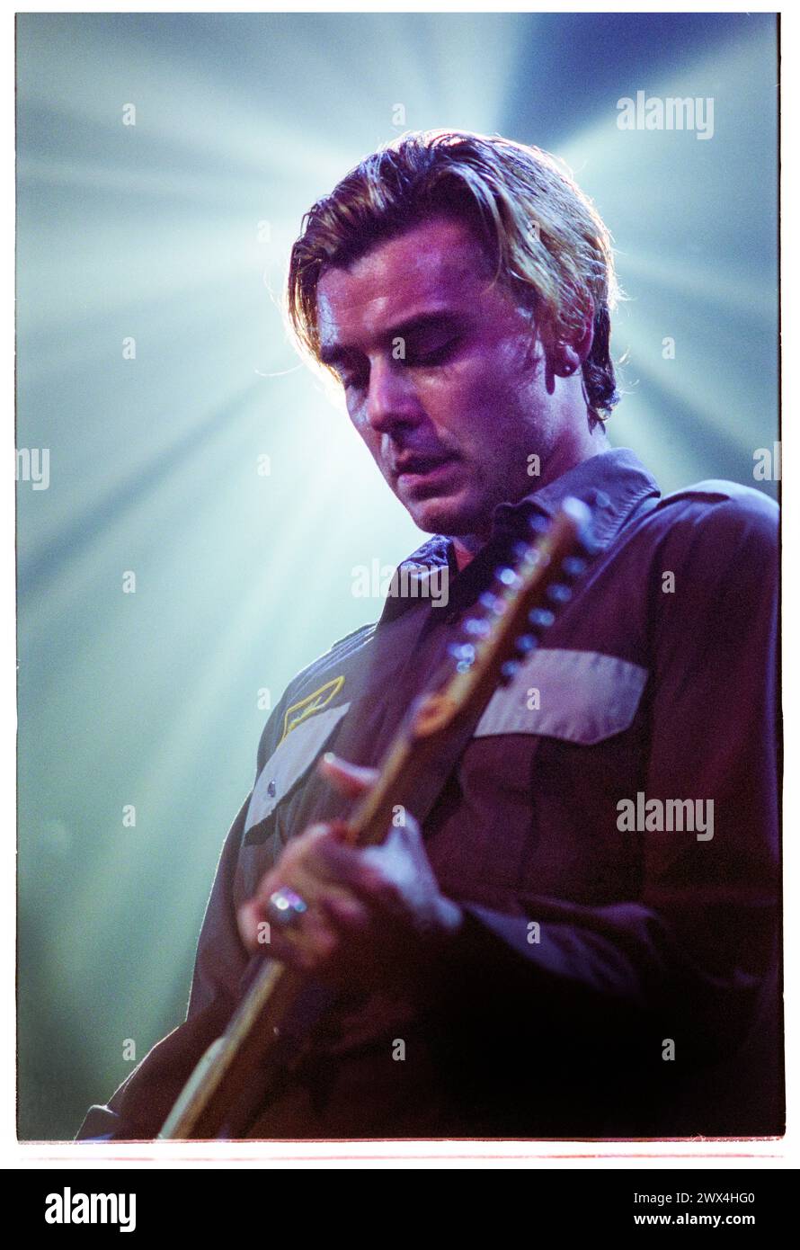 GAVIN ROSSDALE, BUSH, 2001 CONCERT: Gavin Rossdale of the English rock band Bush playing in their original lineup before a 10 year hiatus touring with the 'Golden State' album at Newport Centre in Newport, Wales, UK on 25 November 2001. Photo: Rob Watkins. INFO: Bush, an English rock band formed in 1992, soared to fame with hits like 'Glycerine' and 'Machinehead.' Their grunge-inspired sound, led by Gavin Rossdale's emotive vocals, resonated with audiences worldwide. Stock Photo