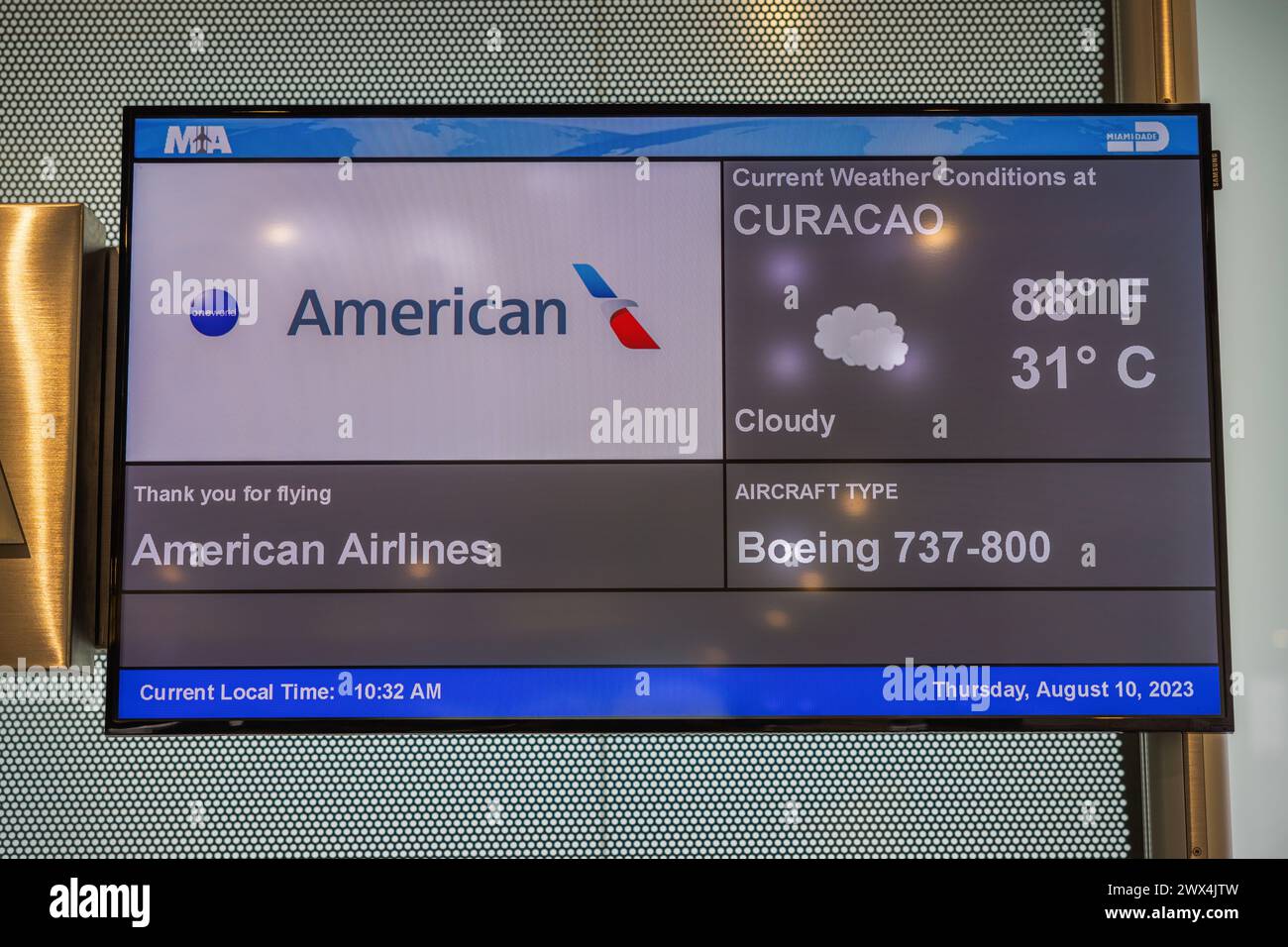 Close-up of the information display of American Airlines, showing flights to Curacao Island, by the gates of the airport. USA. Miami. Stock Photo