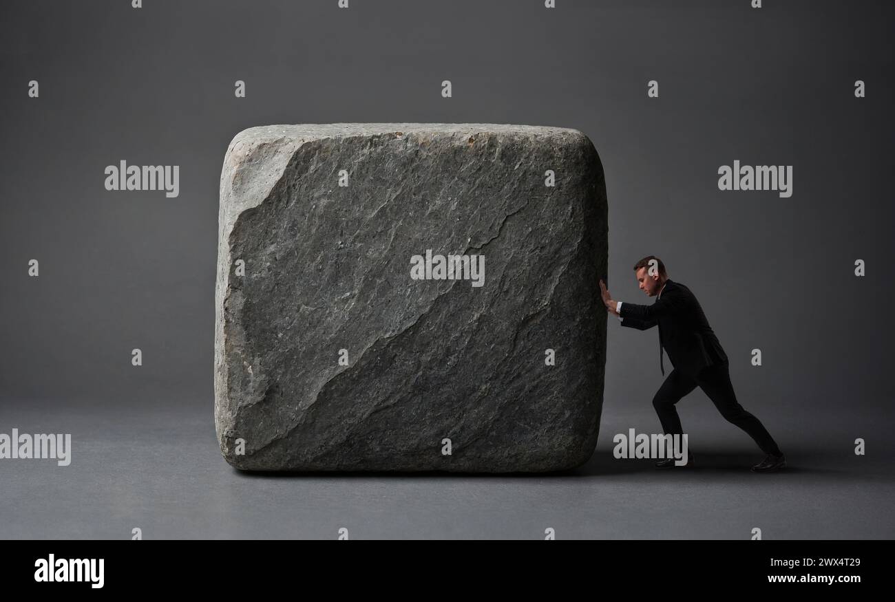 Business men pushing big rock, heavy business concept, unliftable ...
