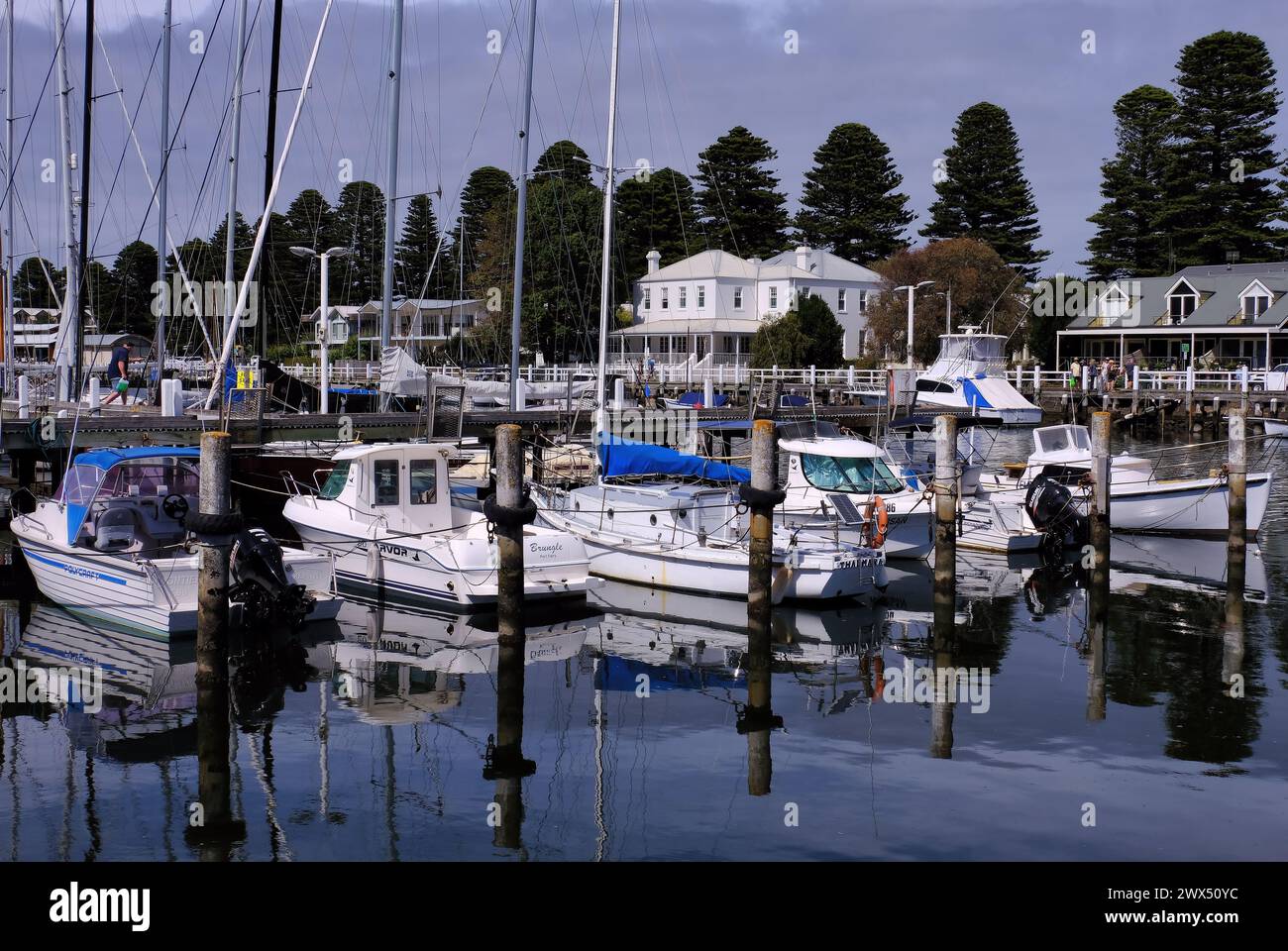 Port Fairy: Boats in Moyne River marina with reflections and Oscars Hotel at Port Fairy Stock Photo