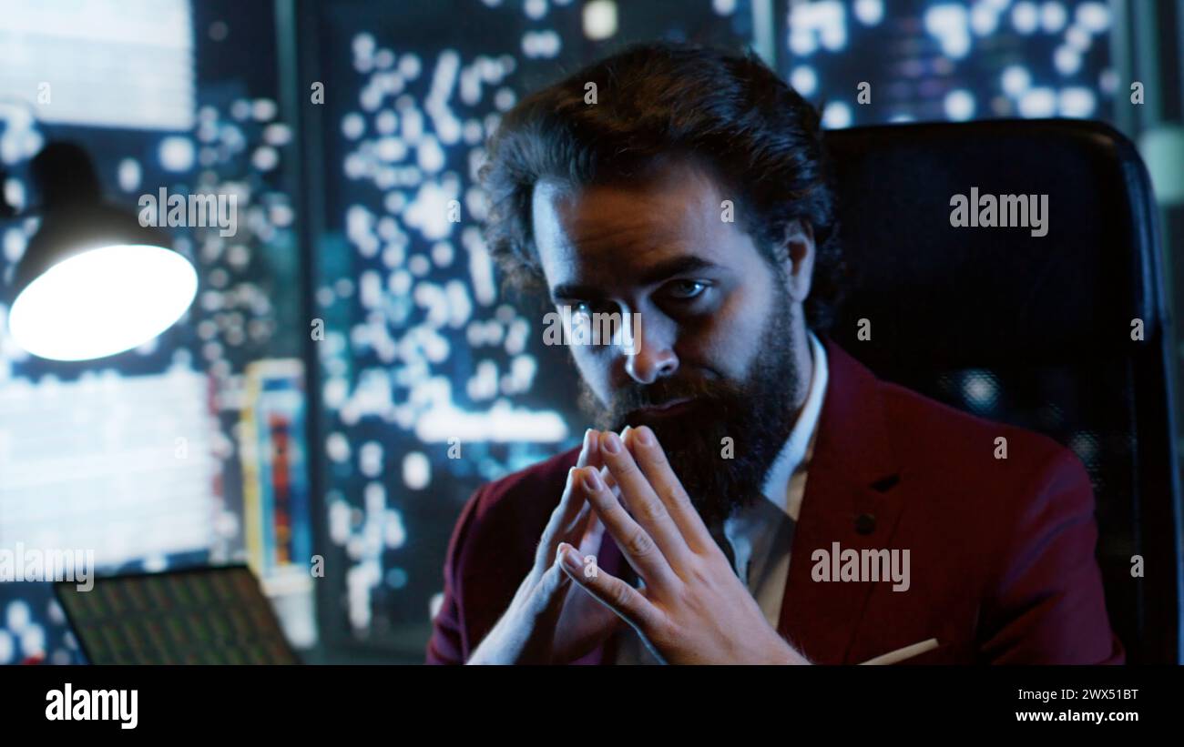 Powerful wealthy banker with vast corporate network rests in his rich tower office, deliberately forging solid legal track record. Worldwide leader earns huge amounts of income from stock trade. Stock Photo