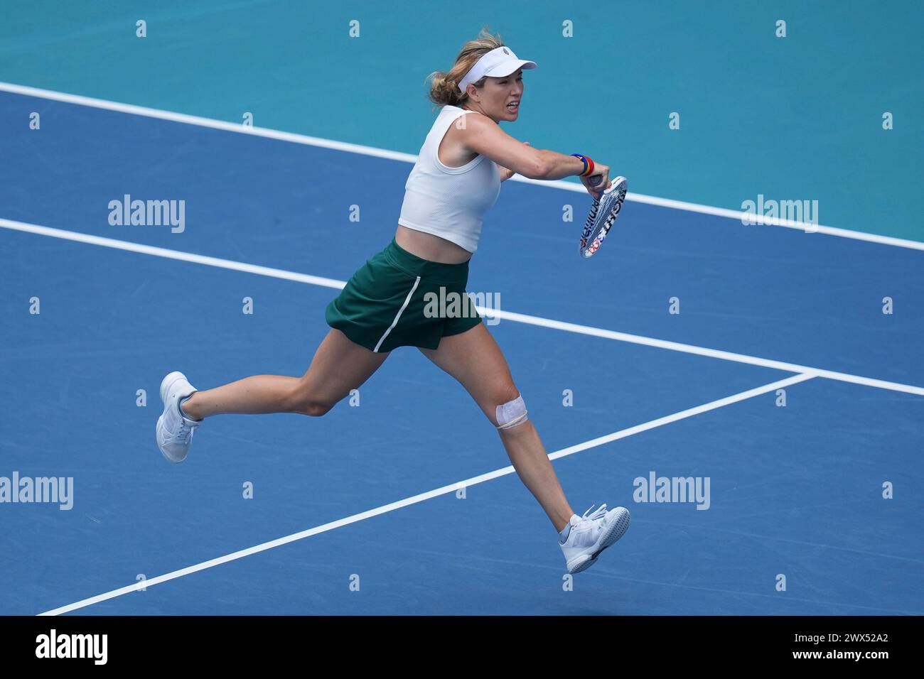 Miami, Florida, USA. 27th Mar, 2024. Danielle Collins (USA) hits a forehand against Caroline Garcia (France) during the quarterfinals of women's singles at the Miami Open tennis tournament. Collins won the match 6-3, 6-2. (Credit Image: © Richard Dole/ZUMA Press Wire) EDITORIAL USAGE ONLY! Not for Commercial USAGE! Stock Photo