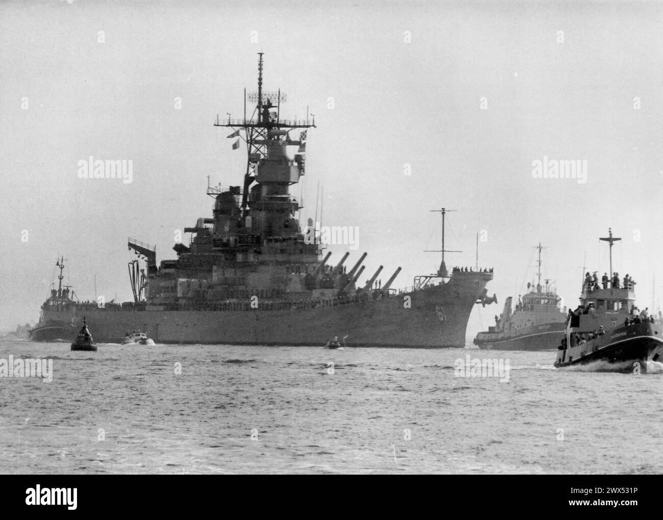 US BATTLESHIP IOWA EMERGES FROM THE MIST TO ENTER PORTSMOUTH HARBOUR ...