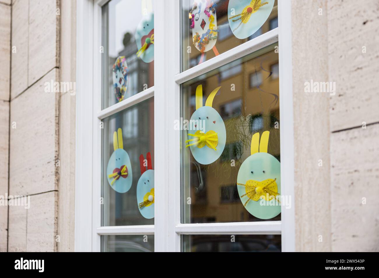 Easter motives on a window of a kindergarten. Walk through Schwabing on