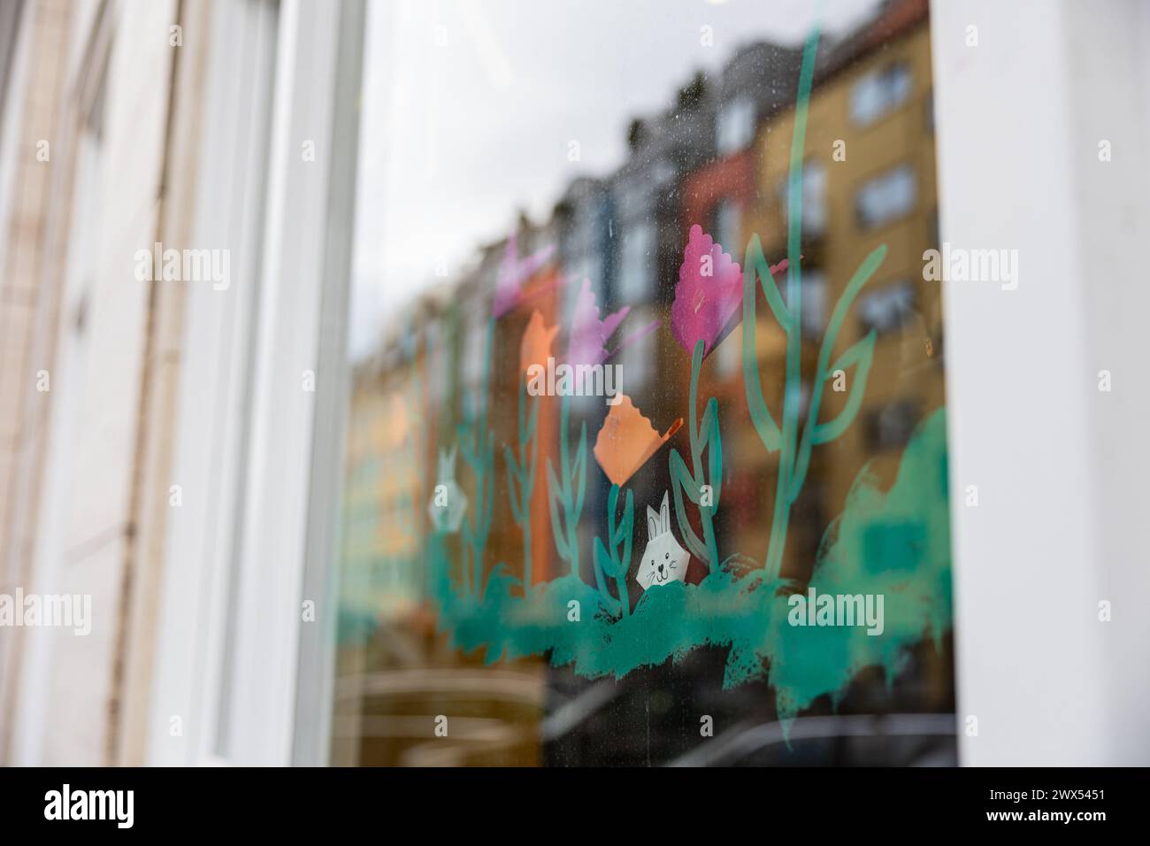 Easter motives on a window of a kindergarten. Walk through Schwabing on