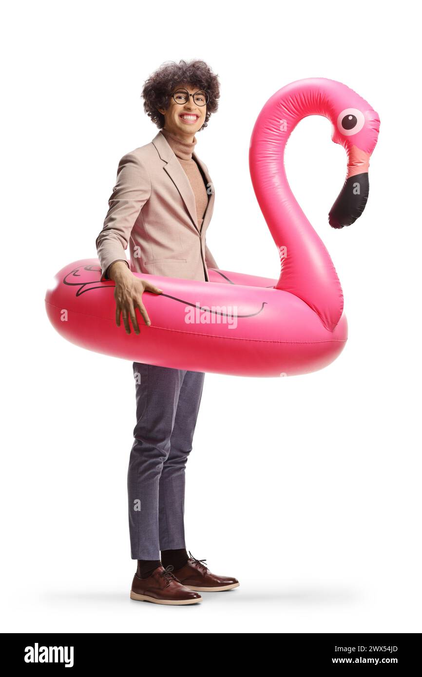 Man with a big inflatable flamingo rubber ring smiling at camera isolated on white background Stock Photo