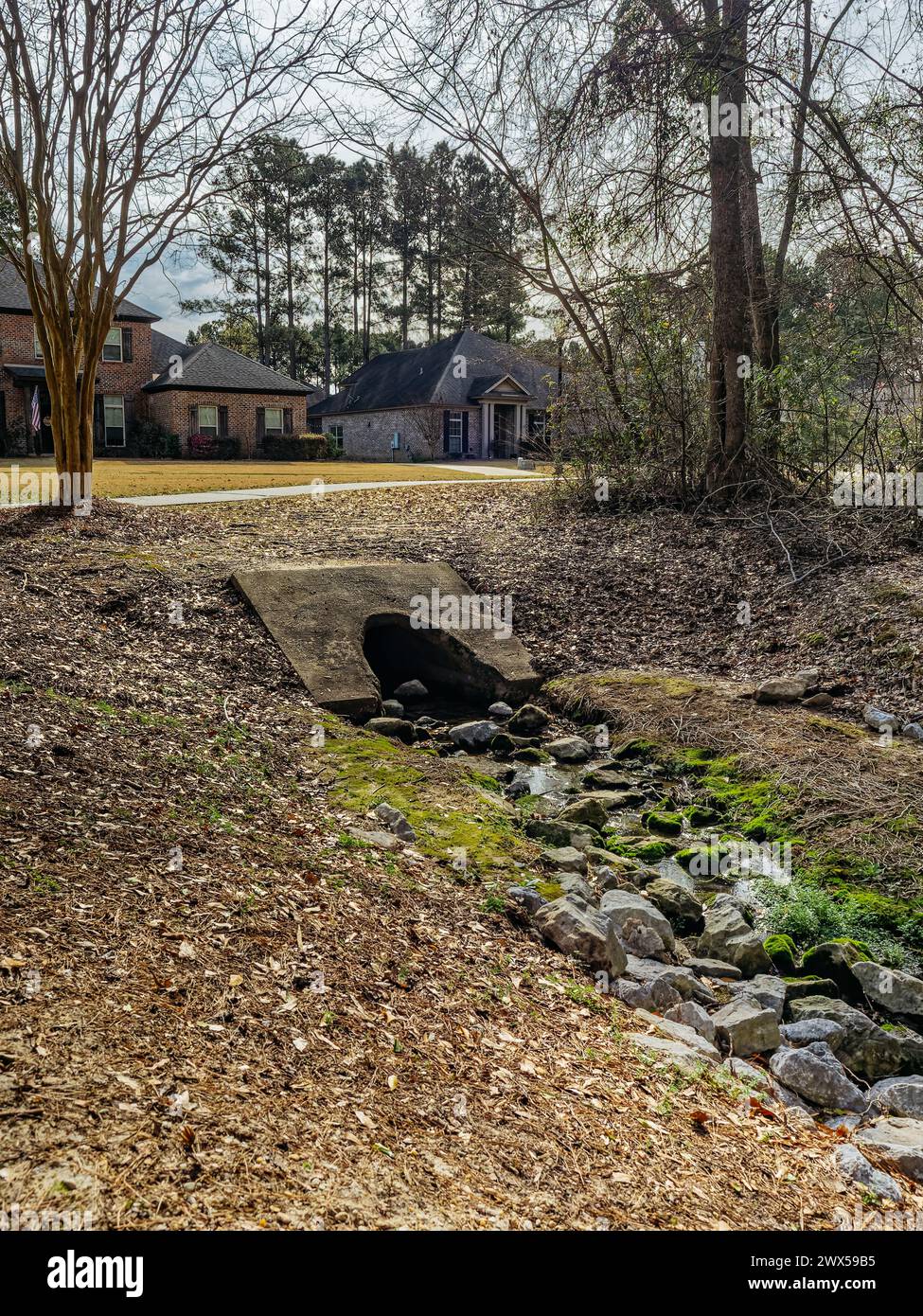Drainage ditch, culvert or creek for residential rainwater runoff in a neighborhood in Pike Road Alabama, USA. Stock Photo