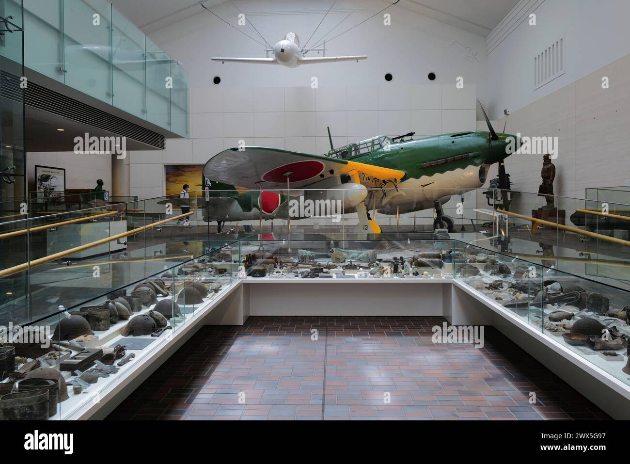 A rocket powered human-guided kamikaze attack-aircraft Ohka with an Imperial Japanese Navy dive-bomber Suisei and other war relics display in Yushukan Museum.Yasukuni Shrine.Tokyo.Japan Stock Photo