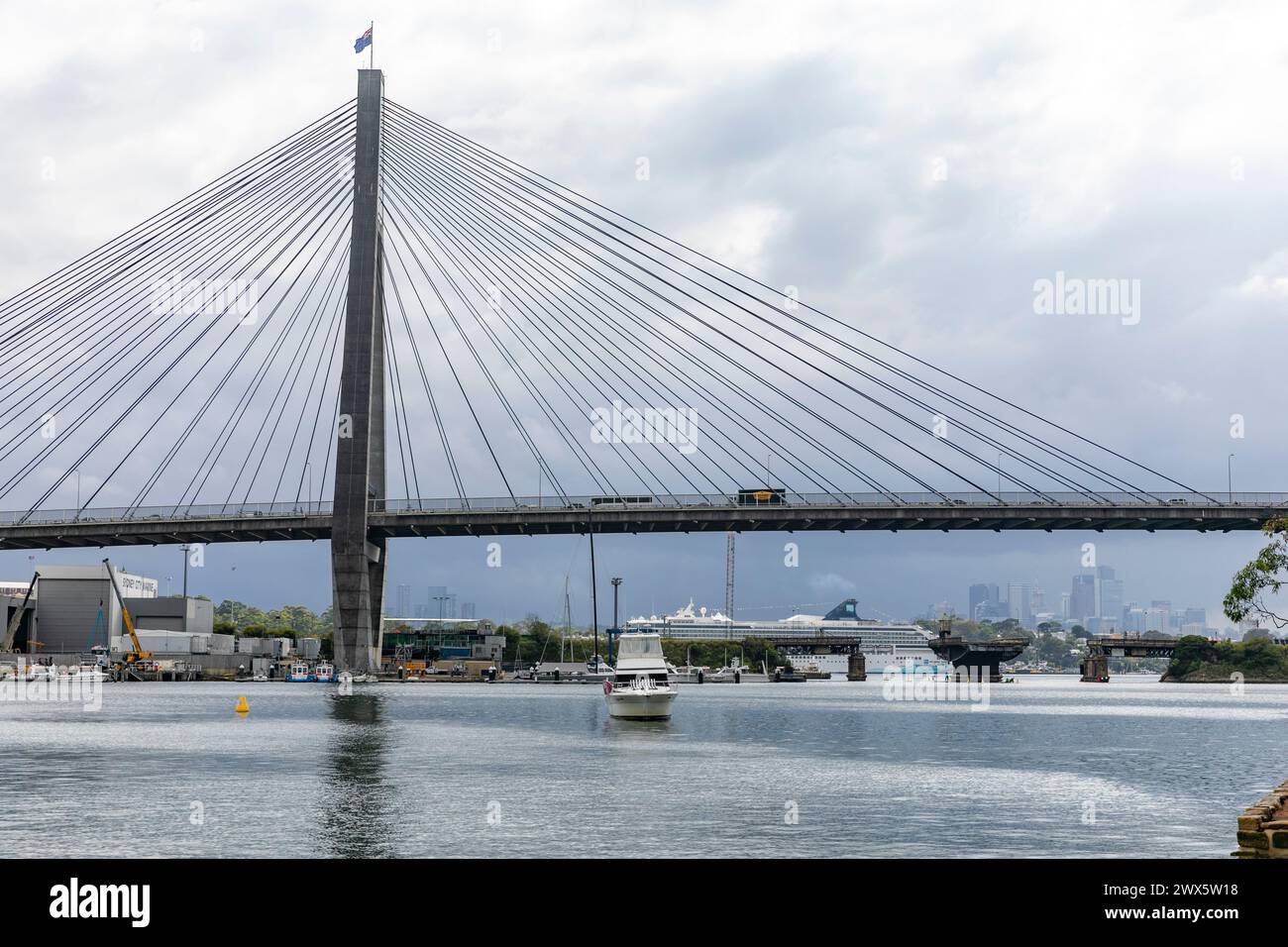 Anzac Bridge in Johnstone Bay,Glebe ,Sydney, with the old glebe bridge and cruise ship at White Bay in the distance, Sydney,New South Wales,Australia Stock Photo