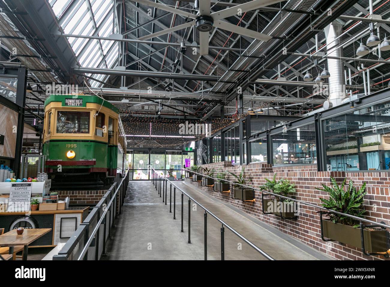 Sydney tram sheds food and cafe precinct in Forest lodge near Glebe, conversion of the former Rozelle tram depot now retail precinct, and tram R1 Stock Photo