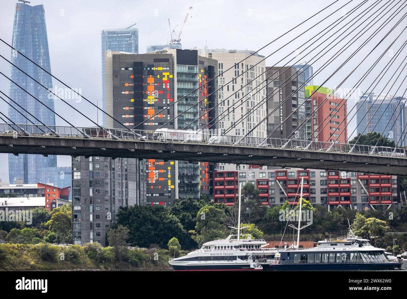 Anzac Bridge across Johnstons Bay in Sydney Harbour,Crown Casino hotel building and ships boats on the harbour,NSW,Australia Stock Photo