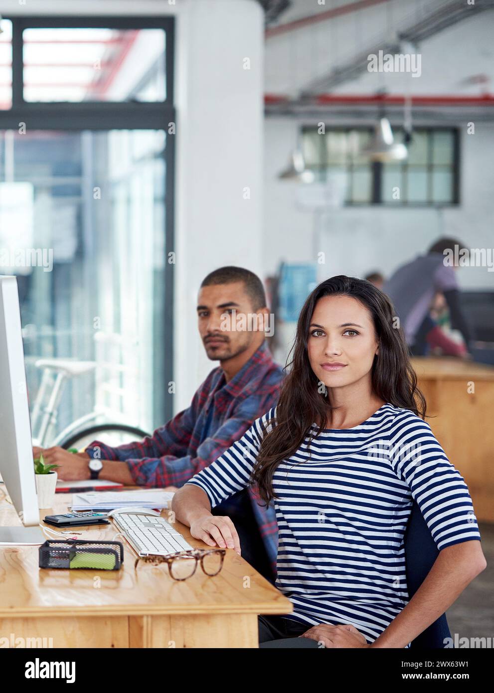 Diverse male female colleagues desk hi-res stock photography and images ...