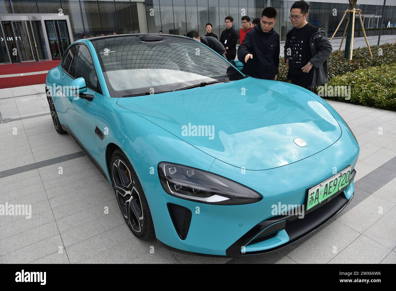 NANJING, CHINA - MARCH 28, 2024 - Customers view XIAOMI SU7, Xiaomi's ...