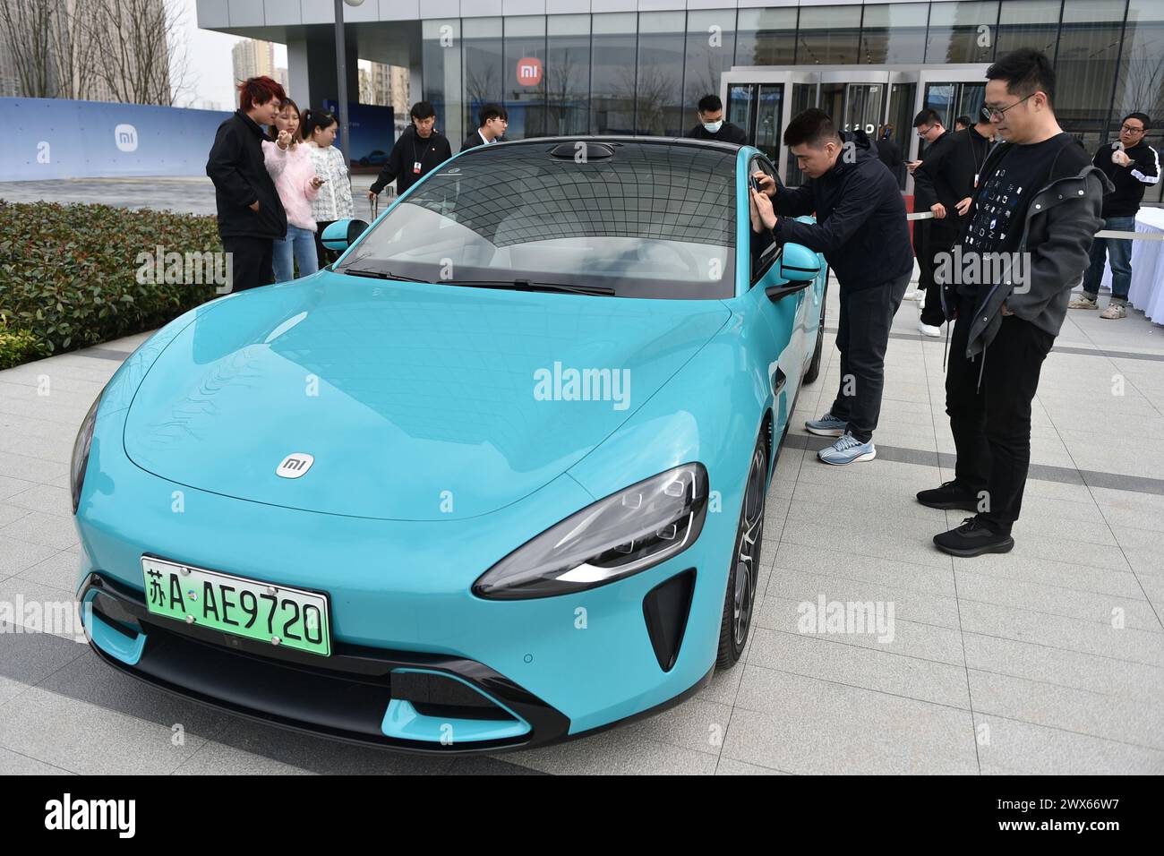 NANJING, CHINA - MARCH 28, 2024 - Customers view XIAOMI SU7, Xiaomi's ...