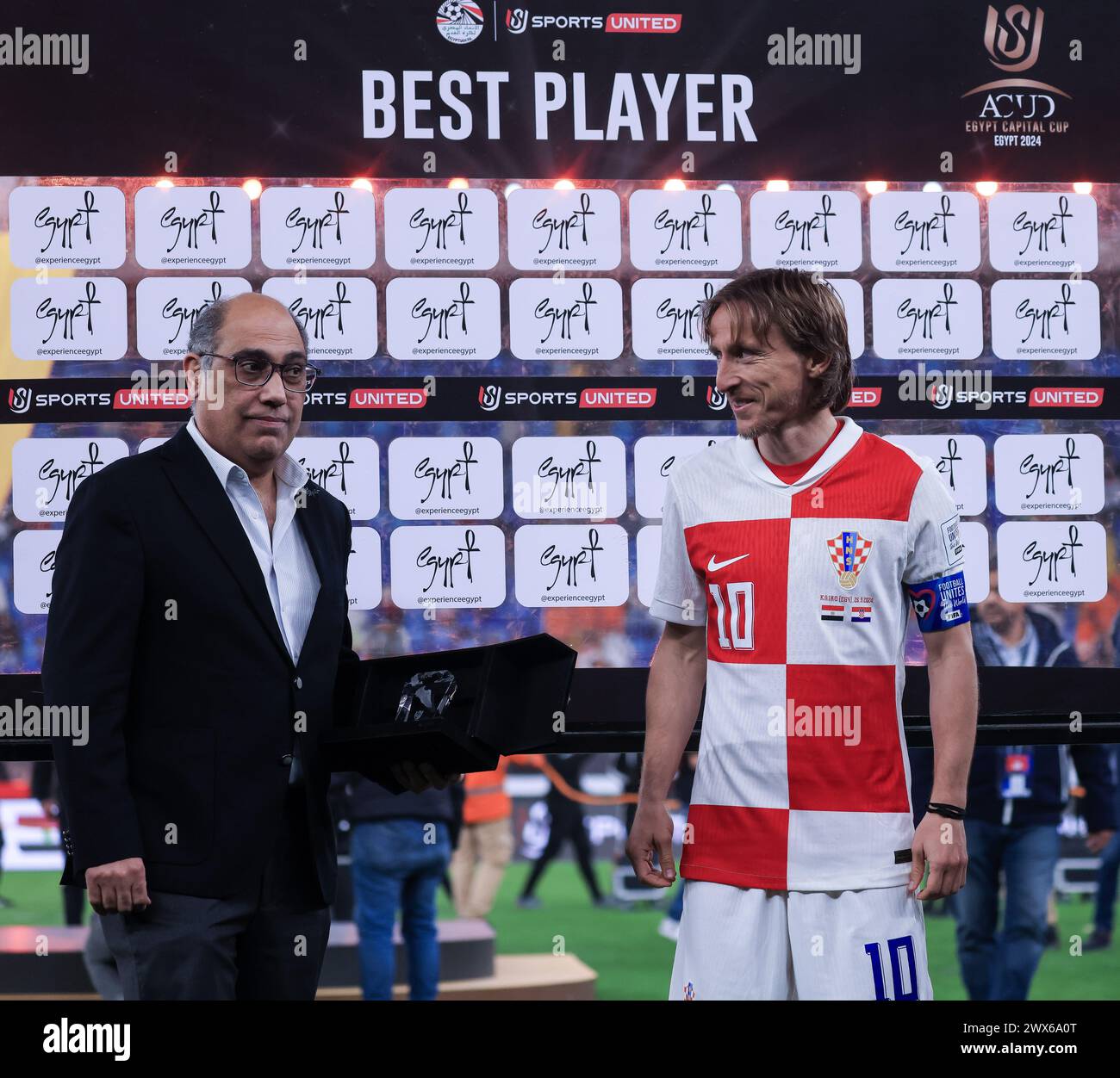 CAIRO, EGYPT - MARCH 26: Luka Modric of Croatia with a player of the ...