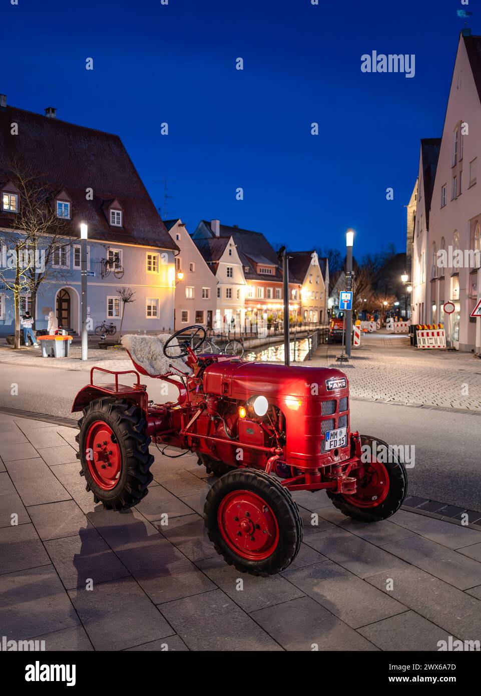 Memmingen, Germany - March 14, 2024: Vintage Fahr agricultural tractor on the street of Memmingen in the blue hour Stock Photo