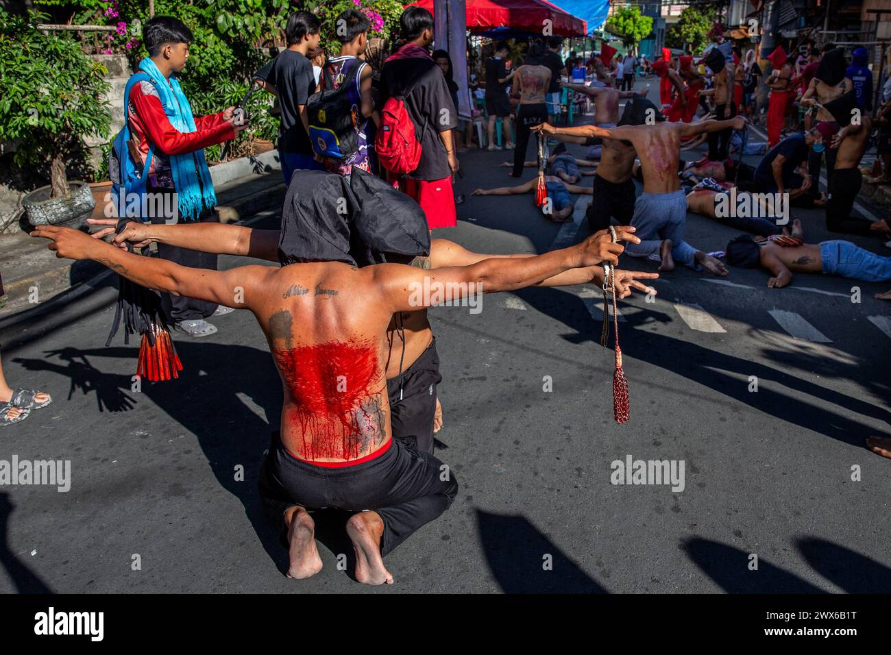 Mandaluyong City, Philippines. 28th Mar, 2024. Filipino penitents participate on self-flagellation on Maundy Thursday. Many Filipino Catholic devotees spend their Holy Week by doing different forms of physical penance to repent for their sins. Credit: SOPA Images Limited/Alamy Live News Stock Photo