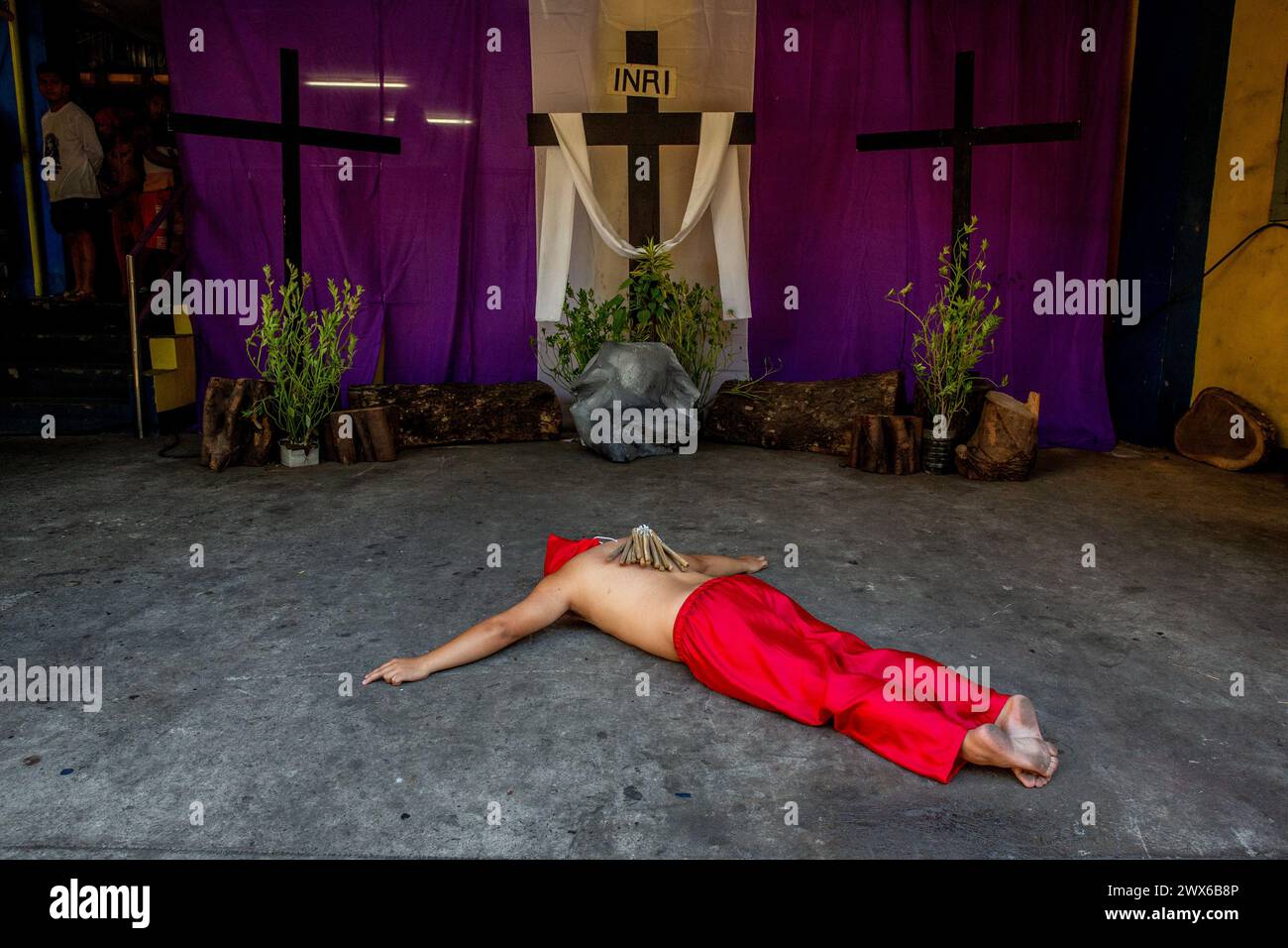 Mandaluyong City, Philippines. 28th Mar, 2024. A Filipino flagellant lies on the floor as part of his penitence on Maundy Thursday. Many Filipino Catholic devotees spend their Holy Week by doing different forms of physical penance to repent for their sins. (Photo by Earvin Perias/SOPA Images/Sipa USA) Credit: Sipa USA/Alamy Live News Stock Photo