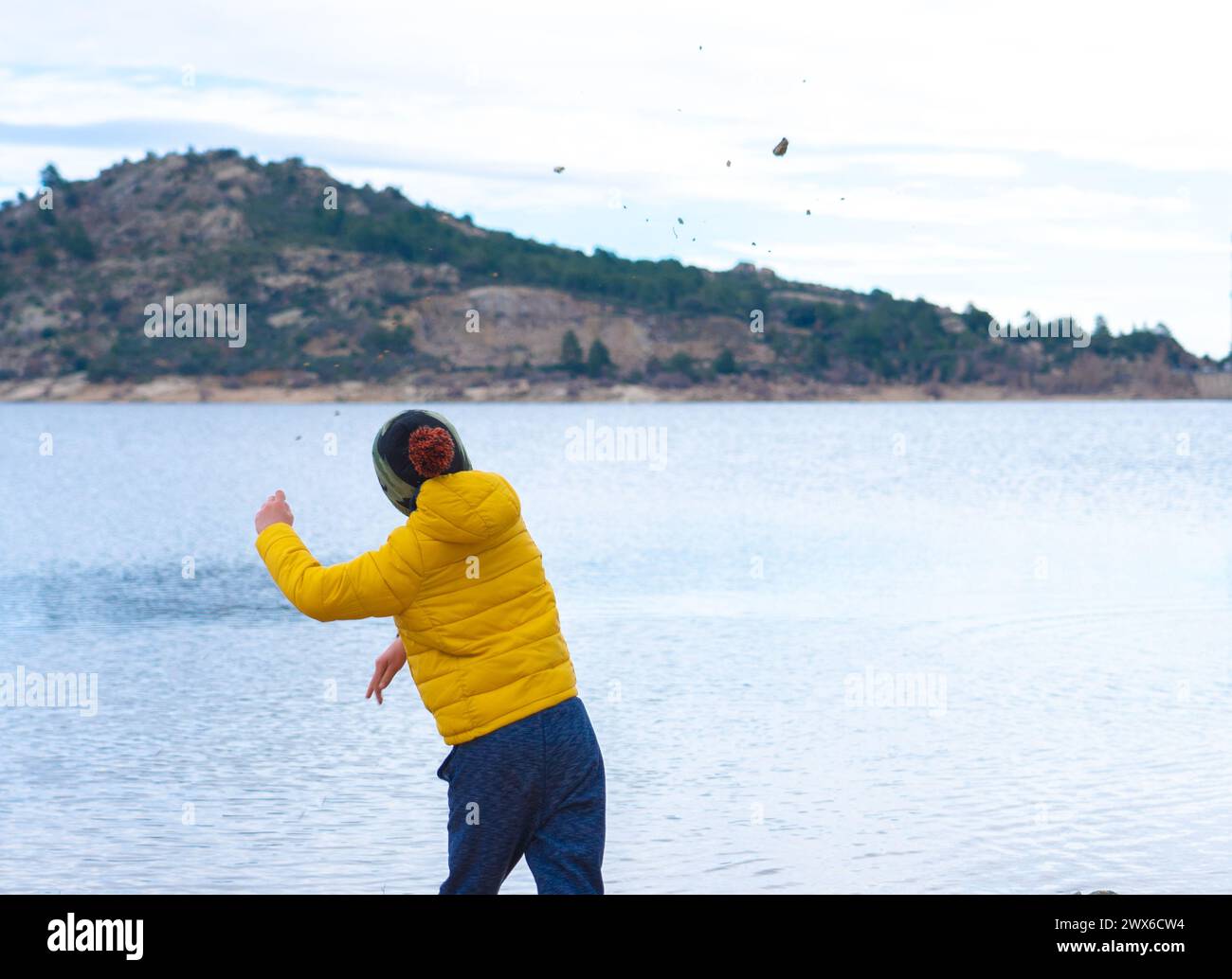 Boy throwing stones hi-res stock photography and images - Alamy