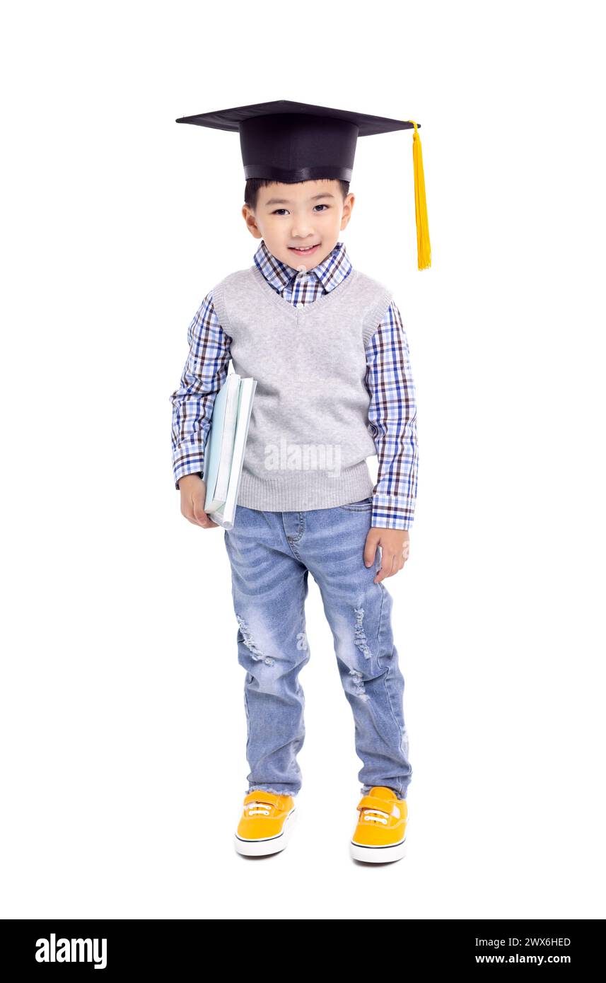Happy Asian school kid graduate in graduation cap Stock Photo