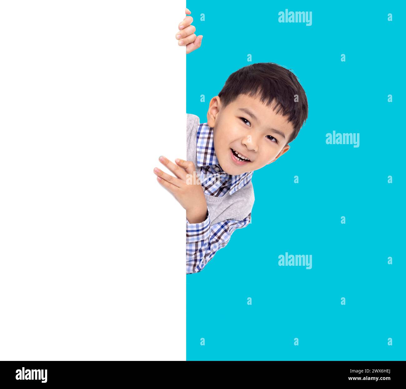 Happy Asian boy  holding with white  empty banner Stock Photo