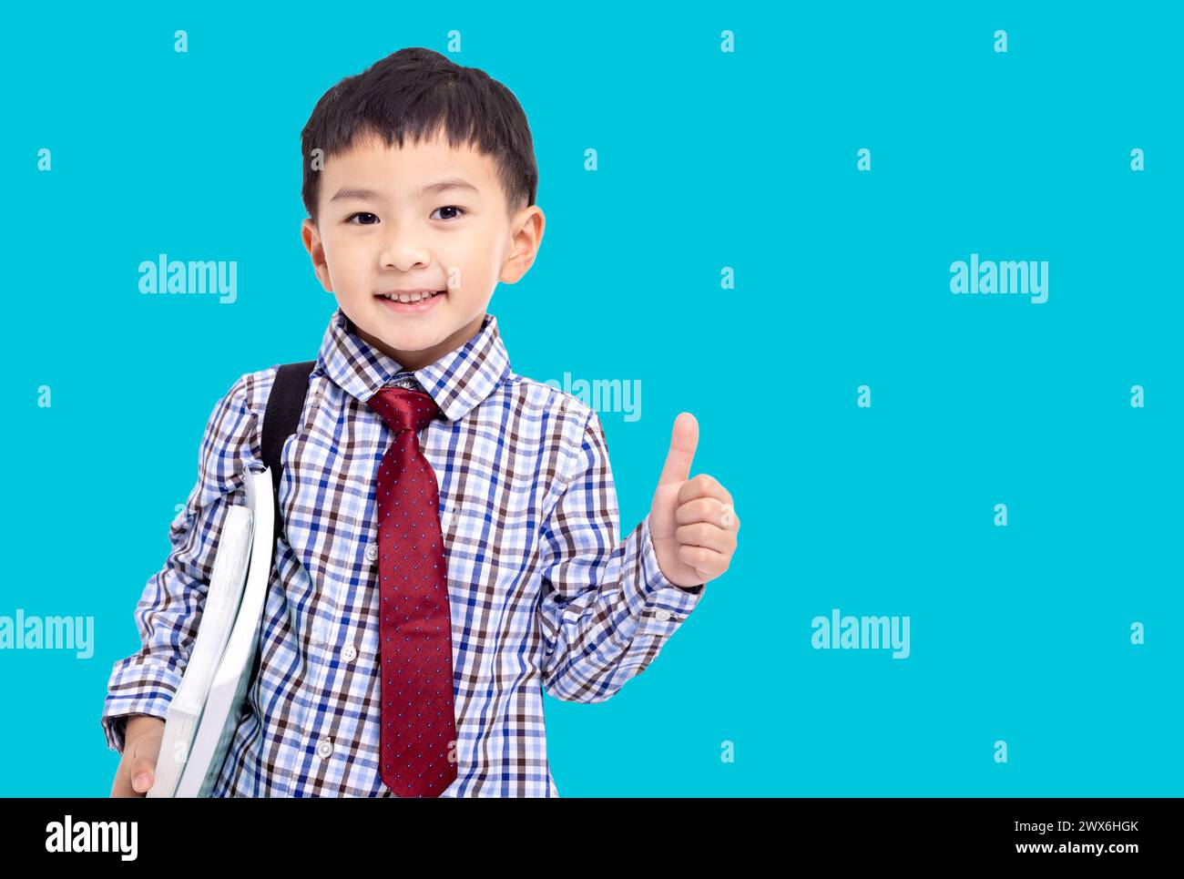 Back to school. Schoolboy  student  showing the thumbs up Stock Photo