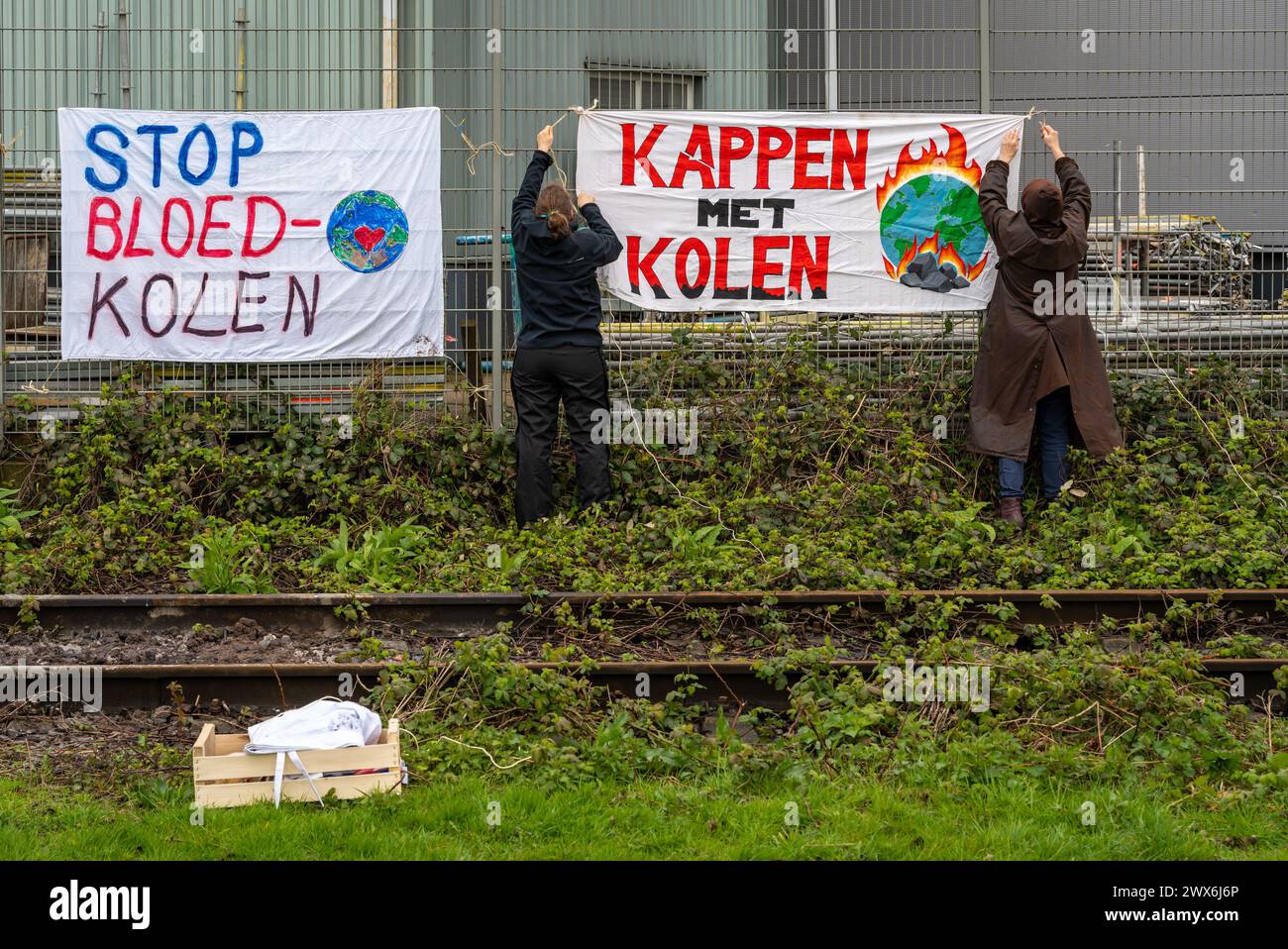 Amsterdam, The Netherlands, 24.03.2024, Climate activists from 'Kappen met Kolen' movement during the protest action at industrial rail track Stock Photo