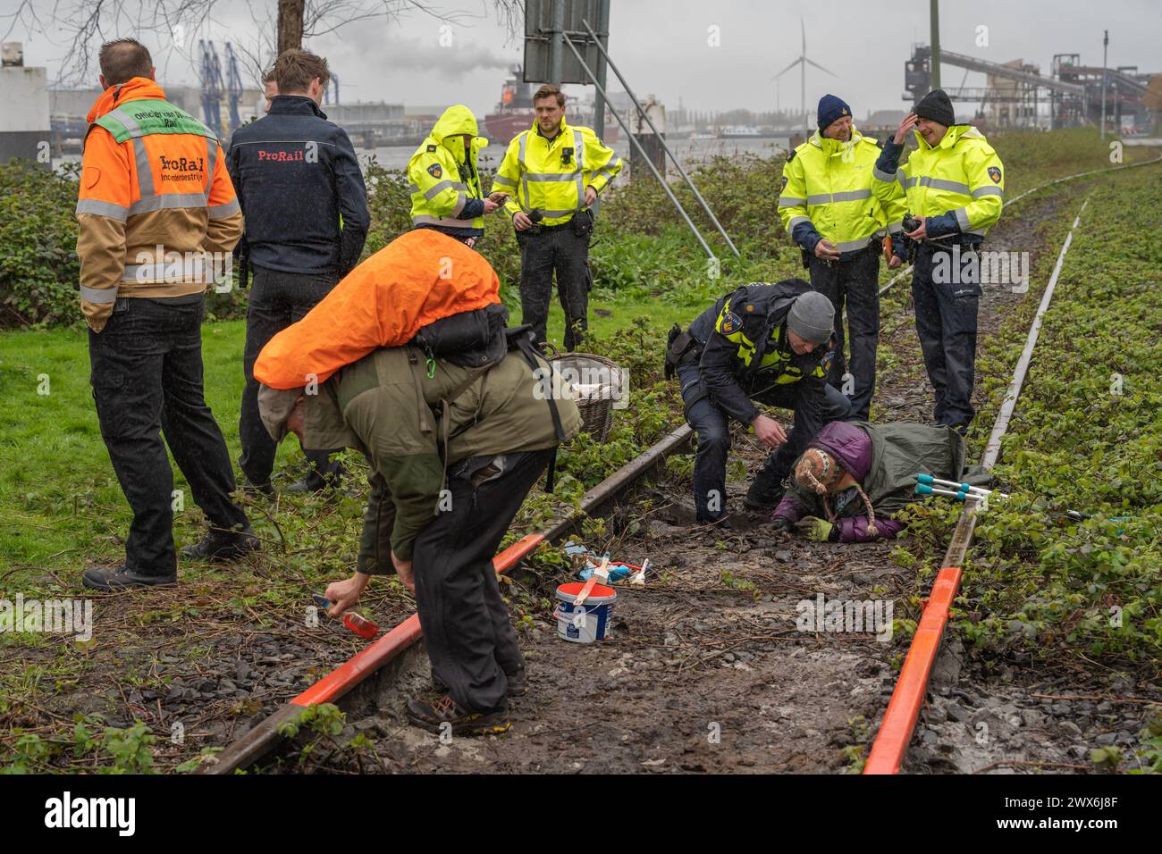 Amsterdam, The Netherlands, 24.03.2024, Climate activists from 'Kappen met Kolen' movement damaging industrial rail track during the protest action Stock Photo