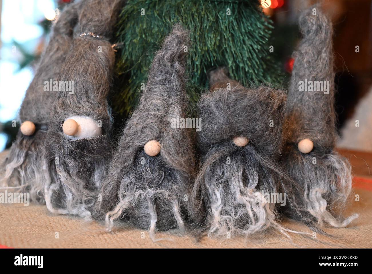 Felted group of wool Santas, seasonal Christmas family and kids' needle felting crafts. Stock Photo