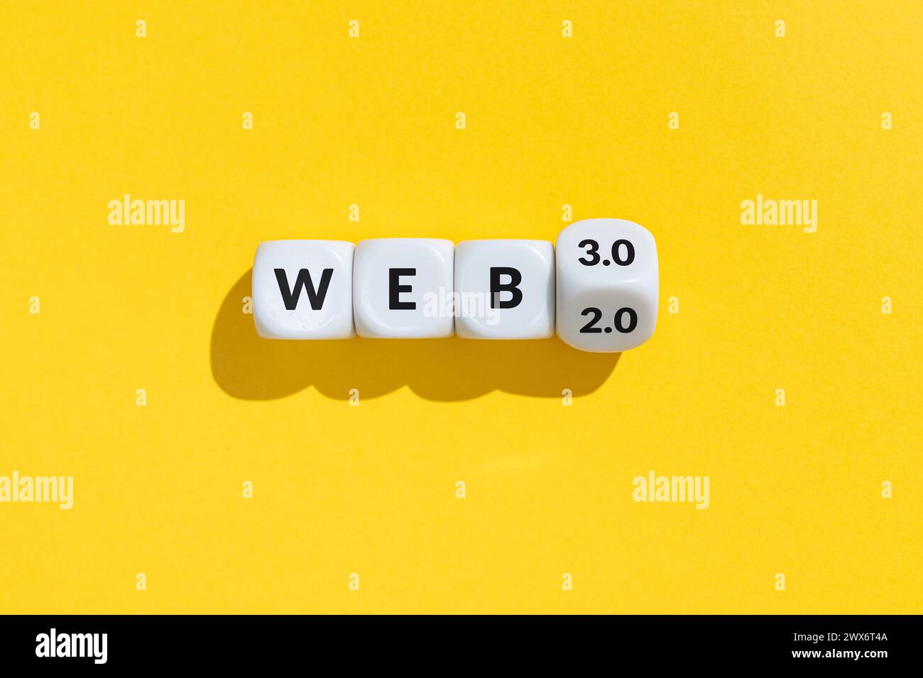 From web 2 to web 3 concept. Cube blocks with text isolated on yellow background Stock Photo