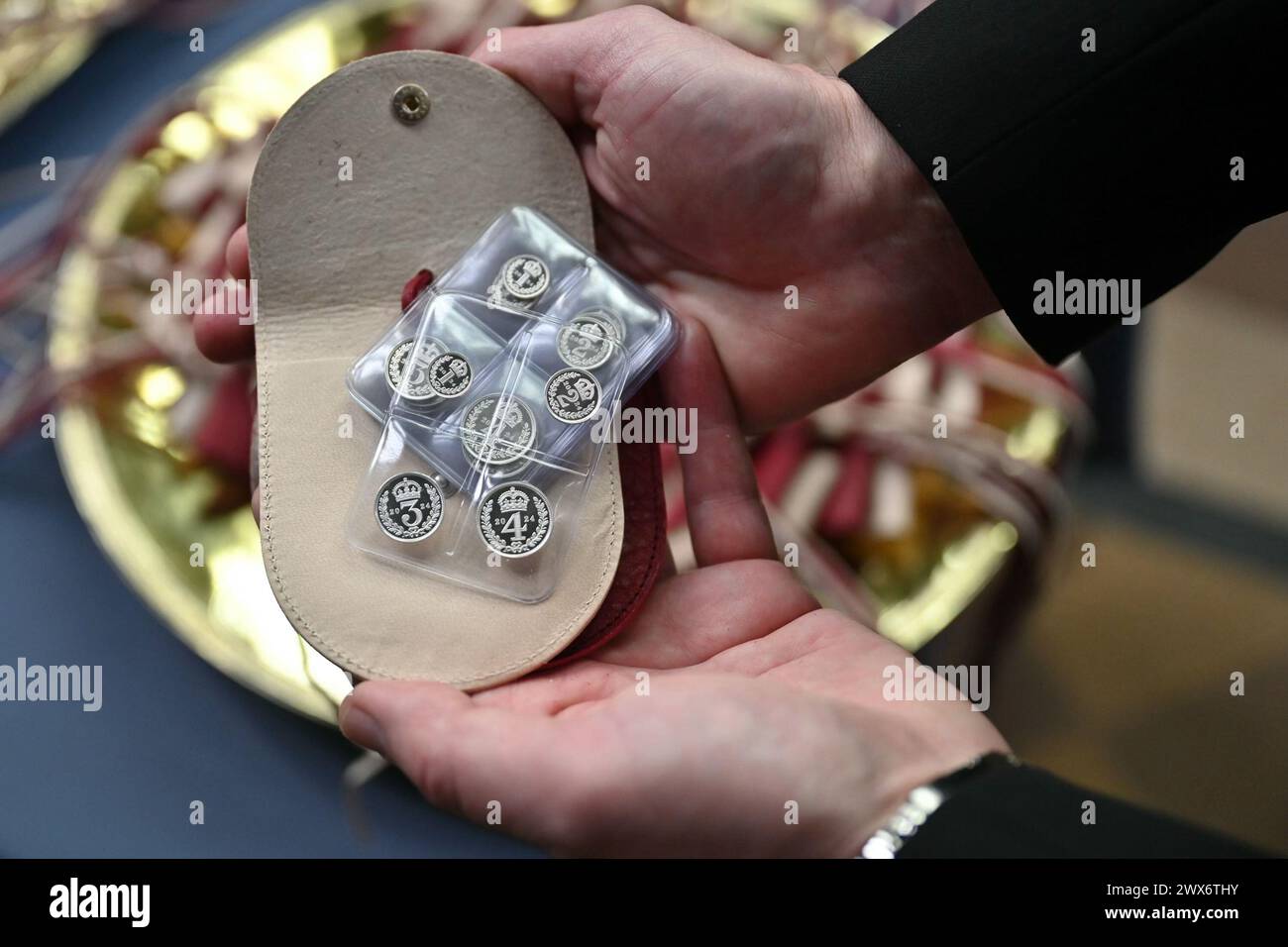 White purses which contain a set of specially minted silver Maundy coins, which Queen Camilla will distribute during the Royal Maundy service at Worcester Cathedral. Picture date: Thursday March 28, 2024. Stock Photo