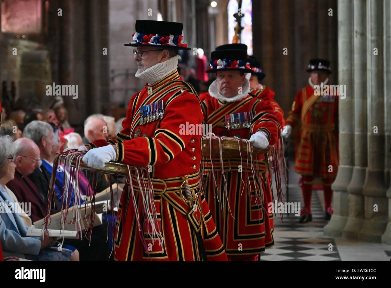 Yeomanry guards carry bowls containing red and white Maundy money purses, which Queen Camilla will distribute during the Royal Maundy service at Worcester Cathedral. Picture date: Thursday March 28, 2024. Stock Photo