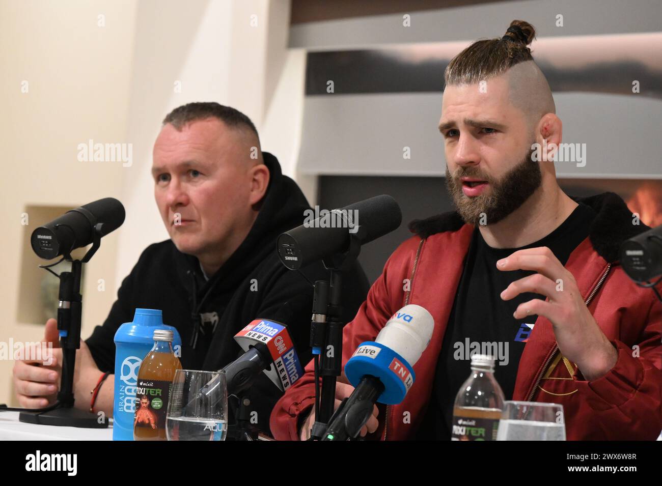 Brno, Czech Republic. 28th Mar, 2024. Czech MMA fighter Jiri Prochazka, right, speaks during a meeting with journalists ahead of the BJP team's scheduled departure for UFC 300 in Las Vegas, USA, on March 28, 2024, in Brno, Czech Republic. On the left side is seen coach Jaroslav Hovezak. Credit: Vaclav Salek/CTK Photo/Alamy Live News Stock Photo